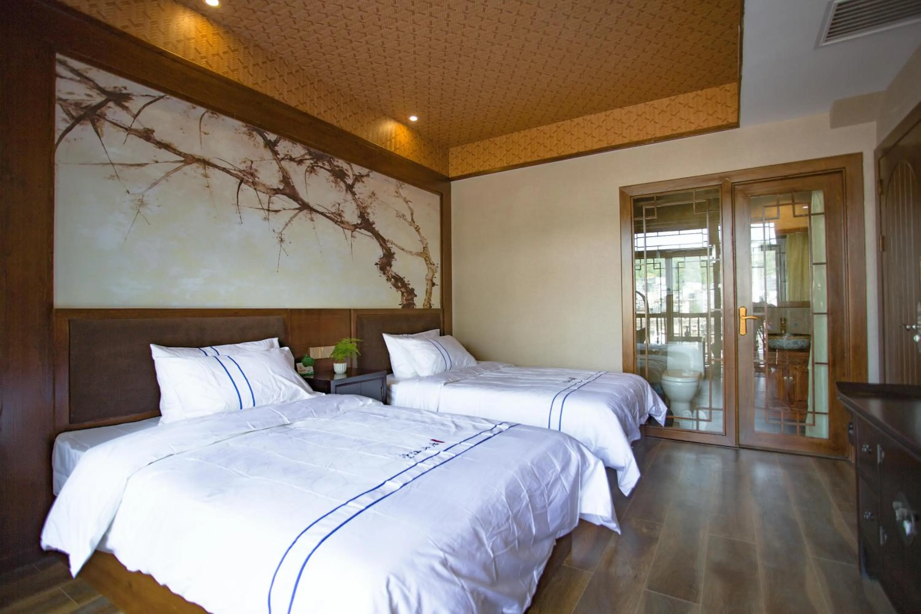 Bed in Wang Jiang Reclusive Boutique Inn