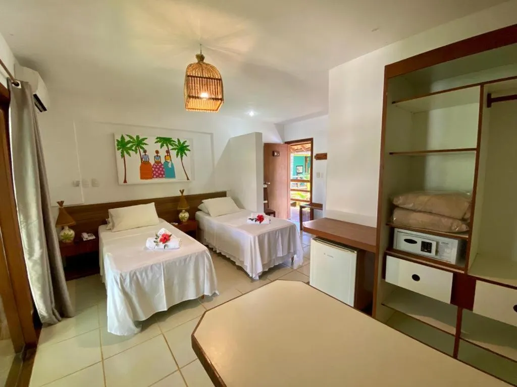 Bed in Pousada Vila do Dengo