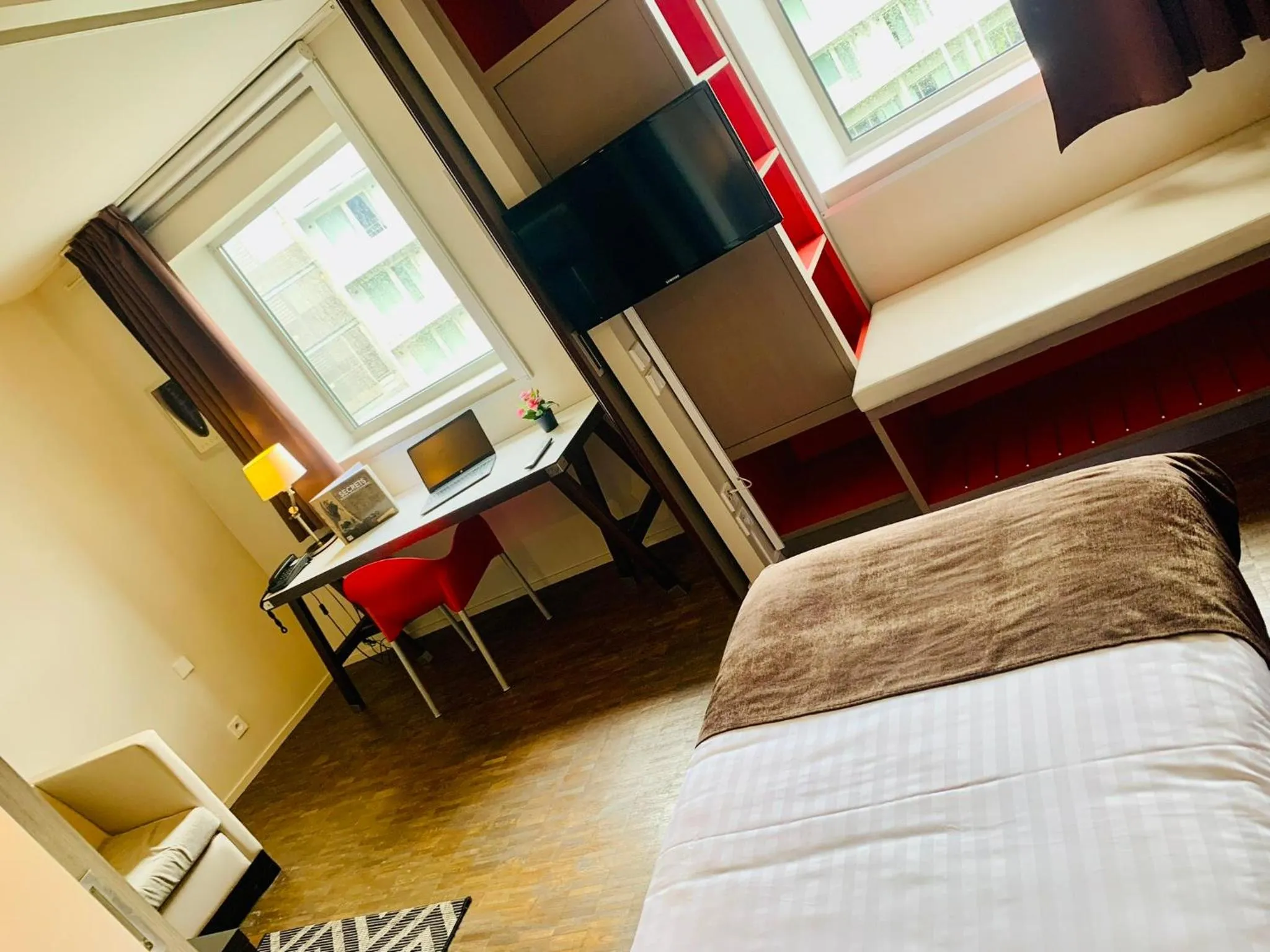 Bed in Standing Hotel Suites by Actisource