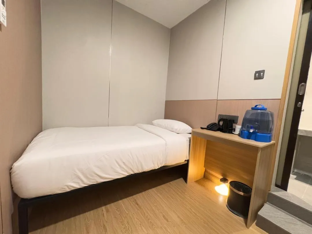 Bed in The Inn Hotel