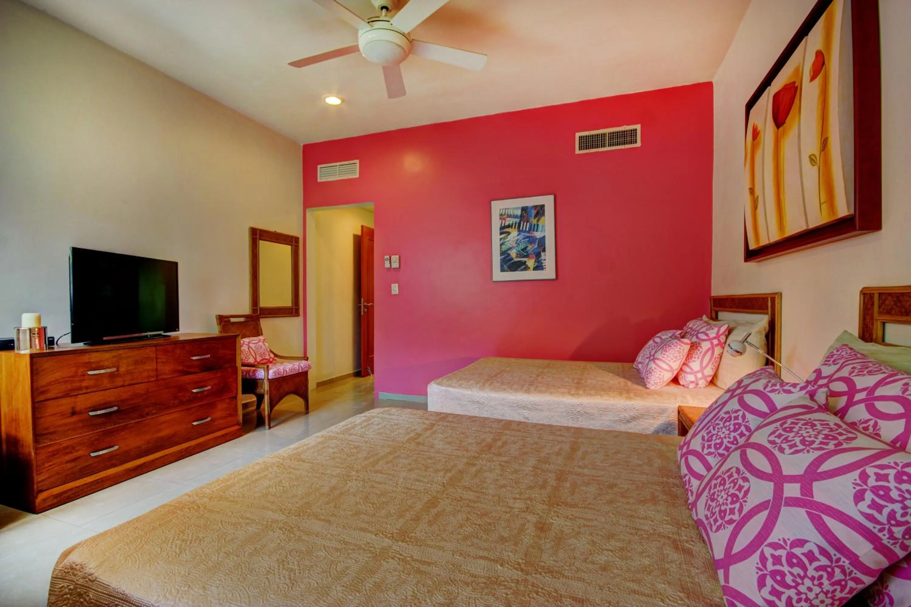 Bed in Riviera Maya Suites