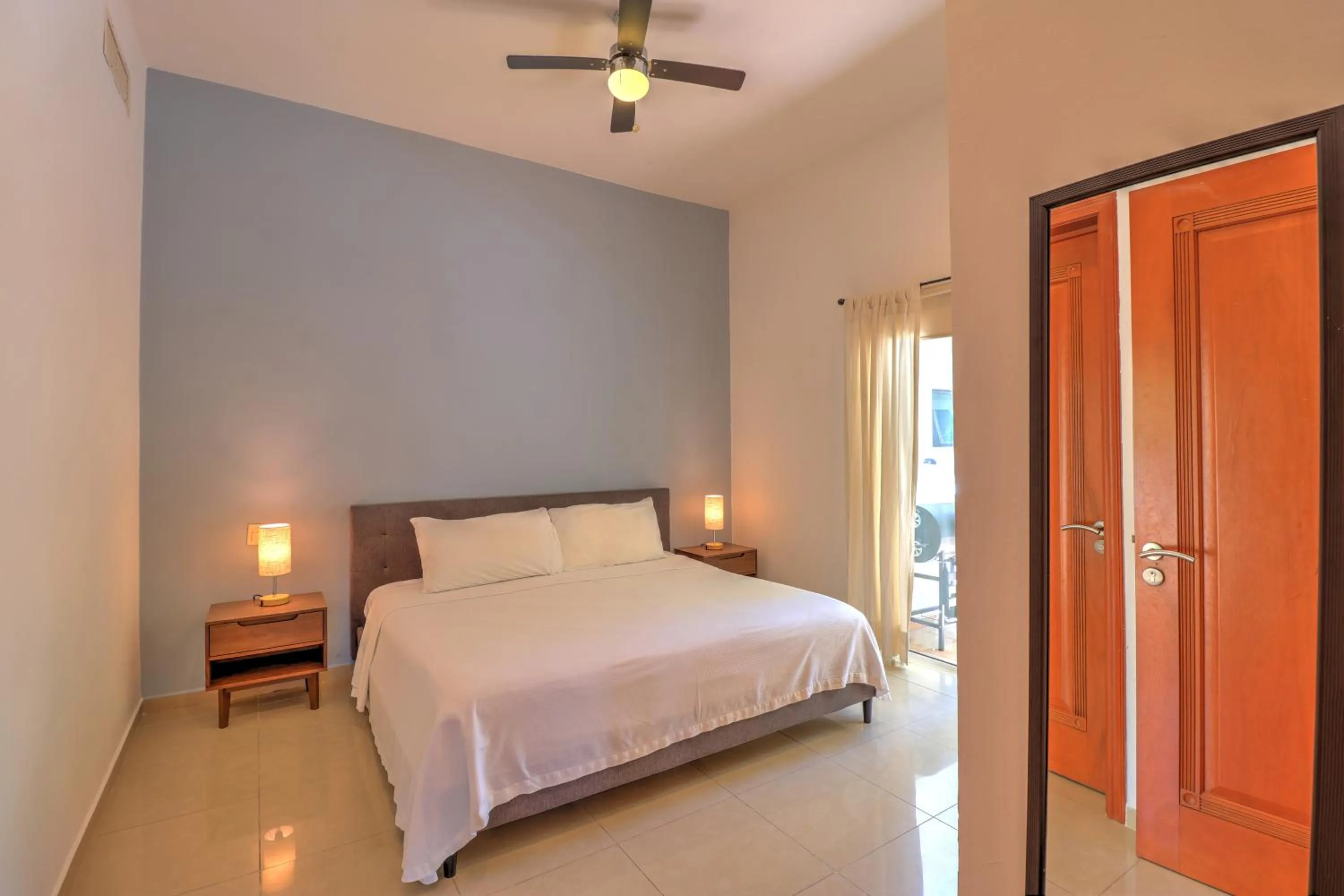 Bed in Riviera Maya Suites