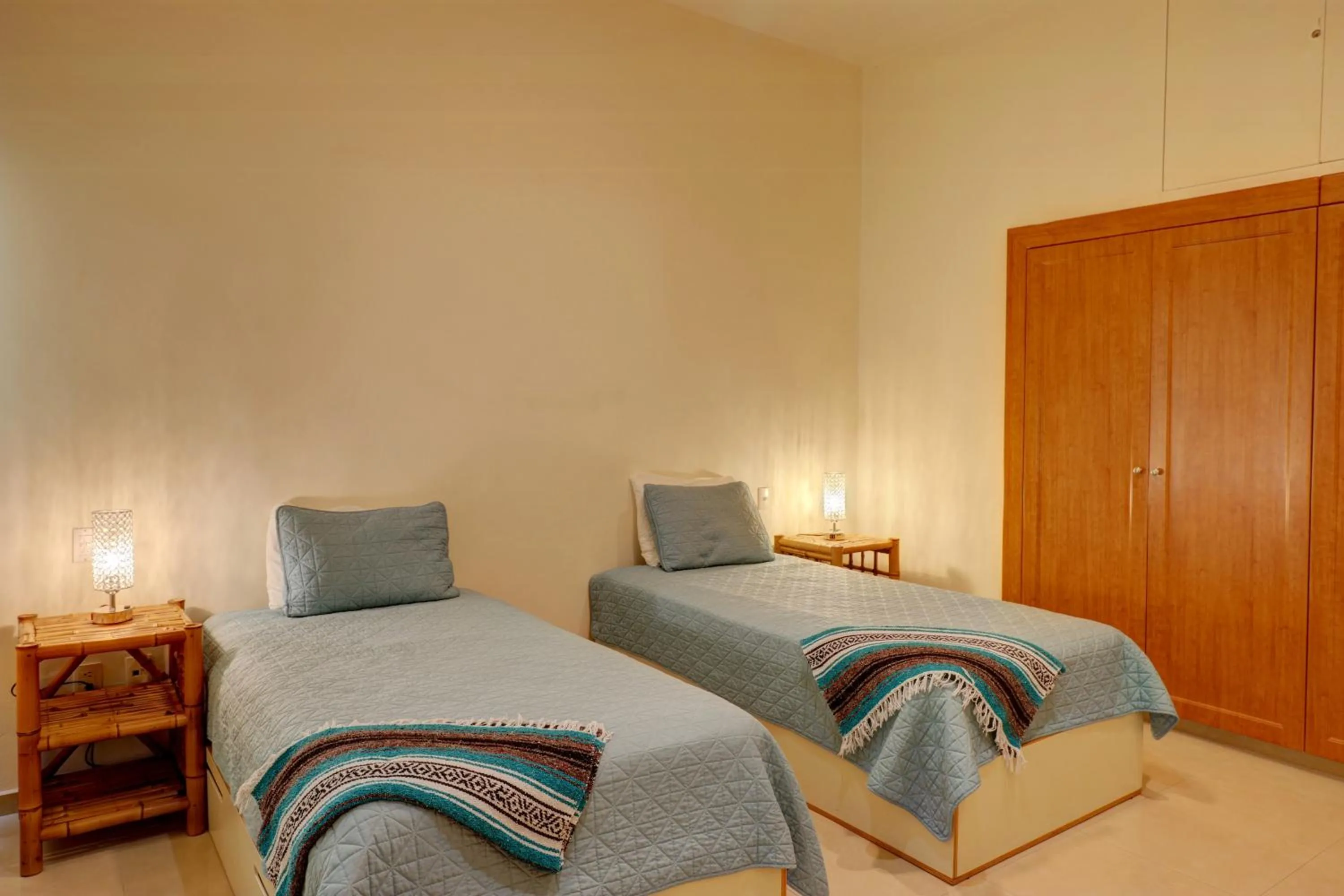 Bed in Riviera Maya Suites