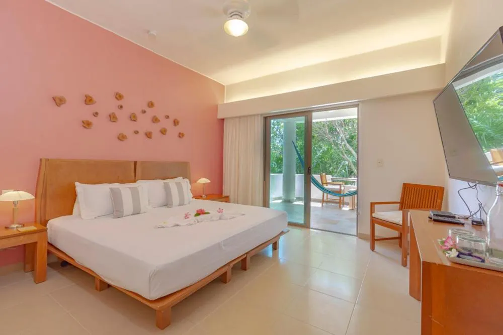 Bed in Riviera Maya Suites