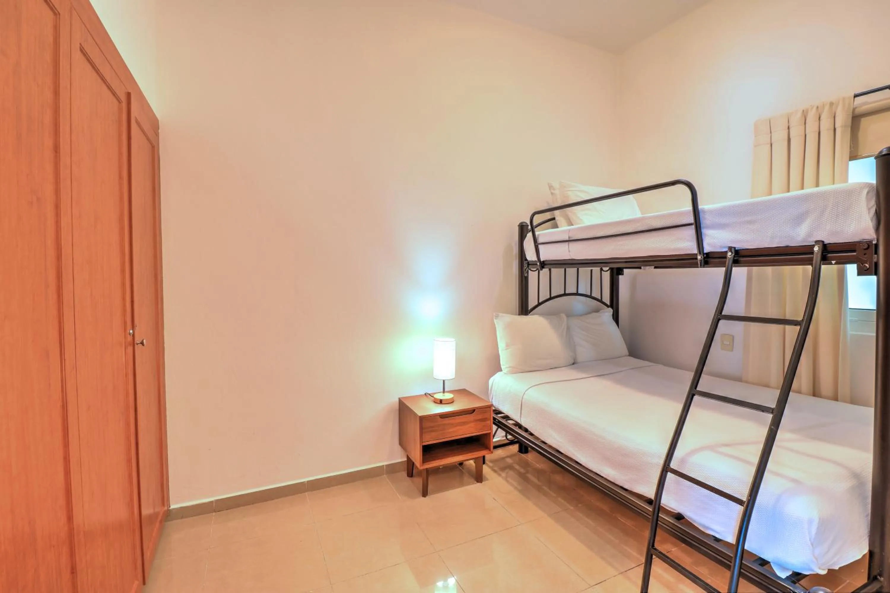 Bed in Riviera Maya Suites