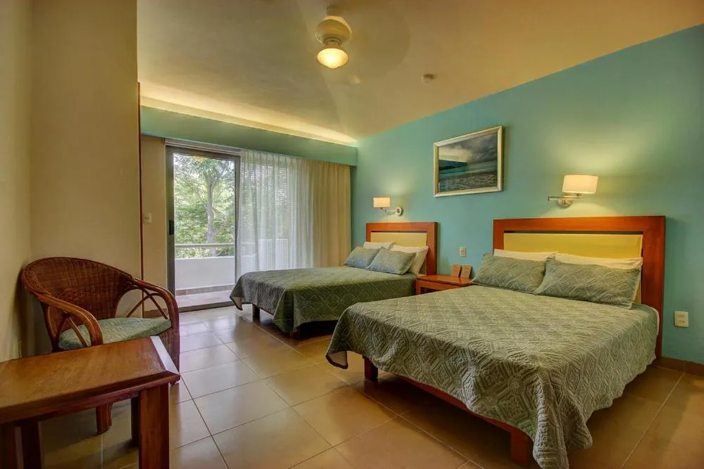 Bed in Riviera Maya Suites