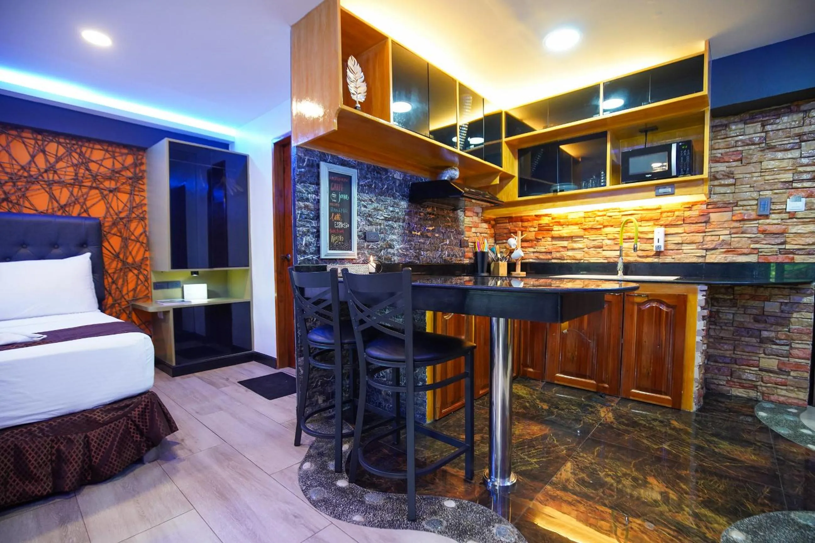 Bed in CLOCKWORKORANGE Luxury Suites