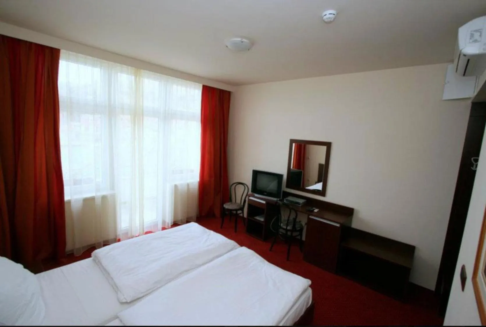 Bed in Lux Hotel Pansion