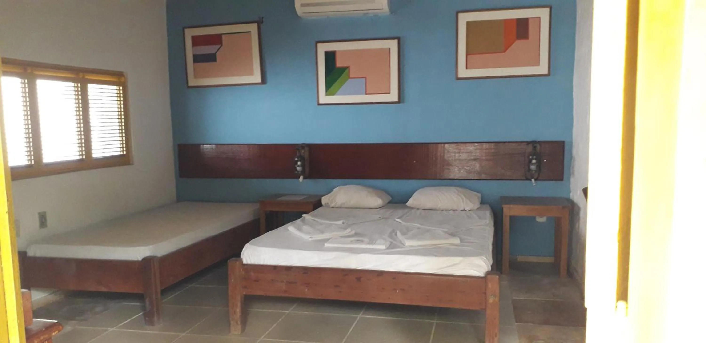 Bed in Pousada Casa Do Angelo