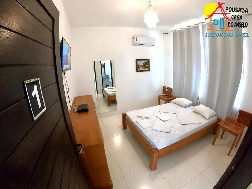 Bed in Pousada Casa Do Angelo