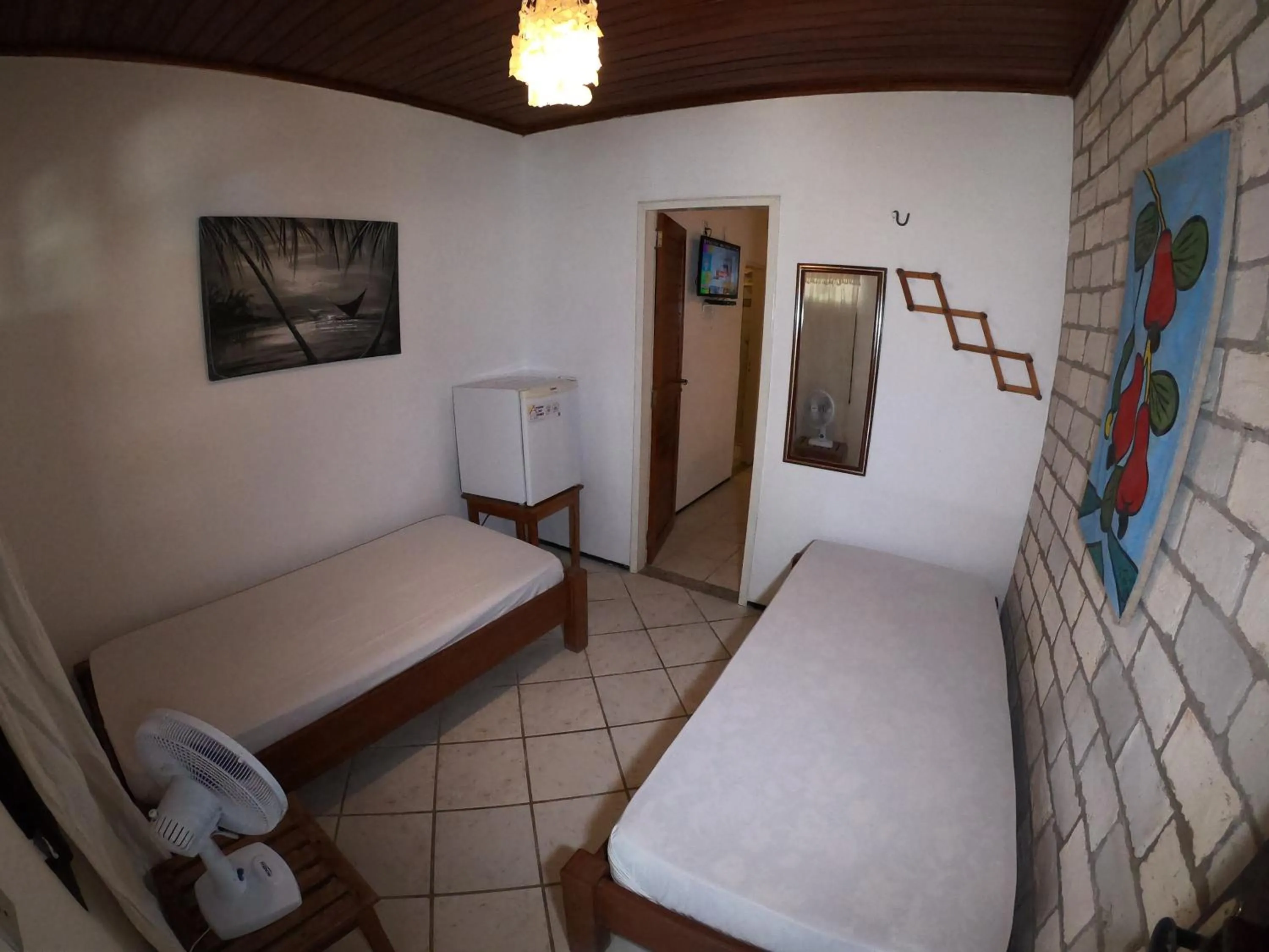 Bed in Pousada Casa Do Angelo