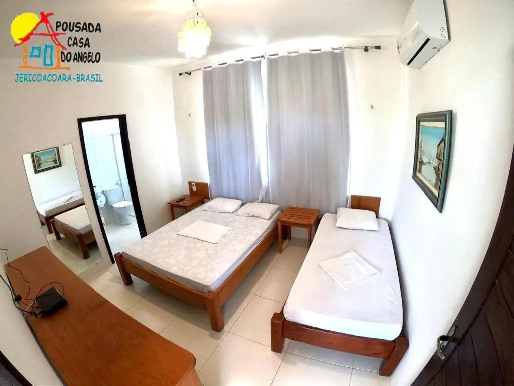 Bed in Pousada Casa Do Angelo