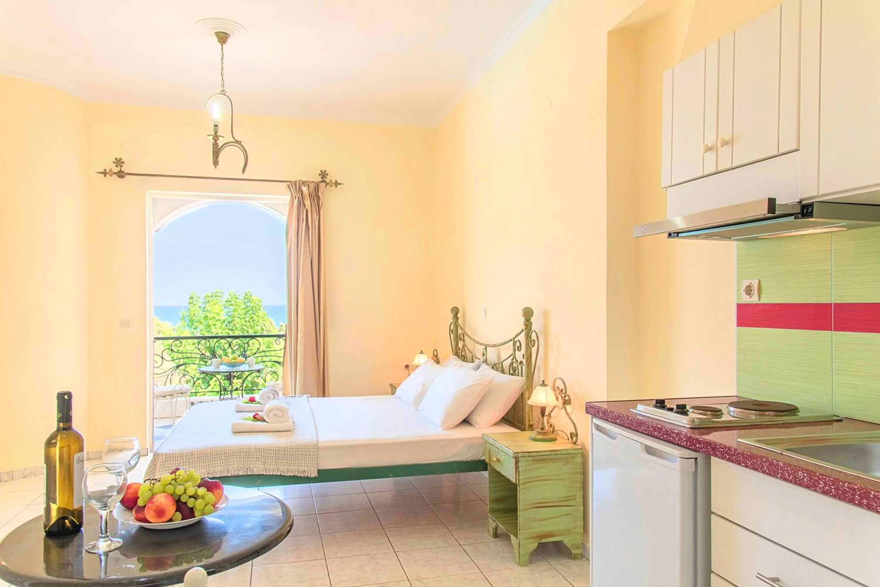 Kitchen or kitchenette, Bed in Palladion Hotel