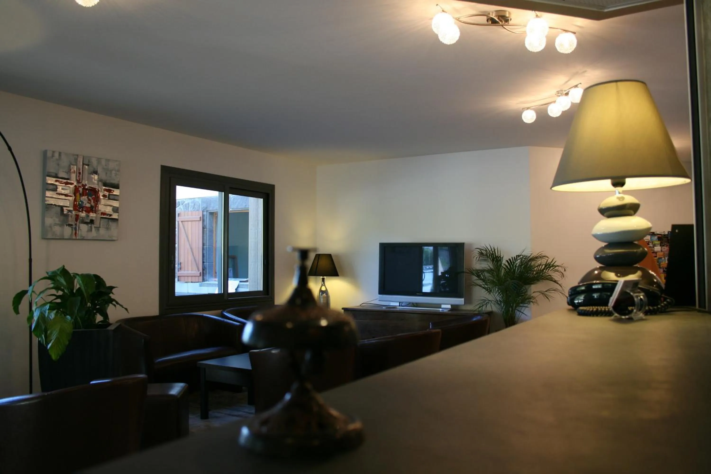 Communal lounge/ TV room in Auberge de la Petite Ferme, Super-Besse Est, The Originals Relais