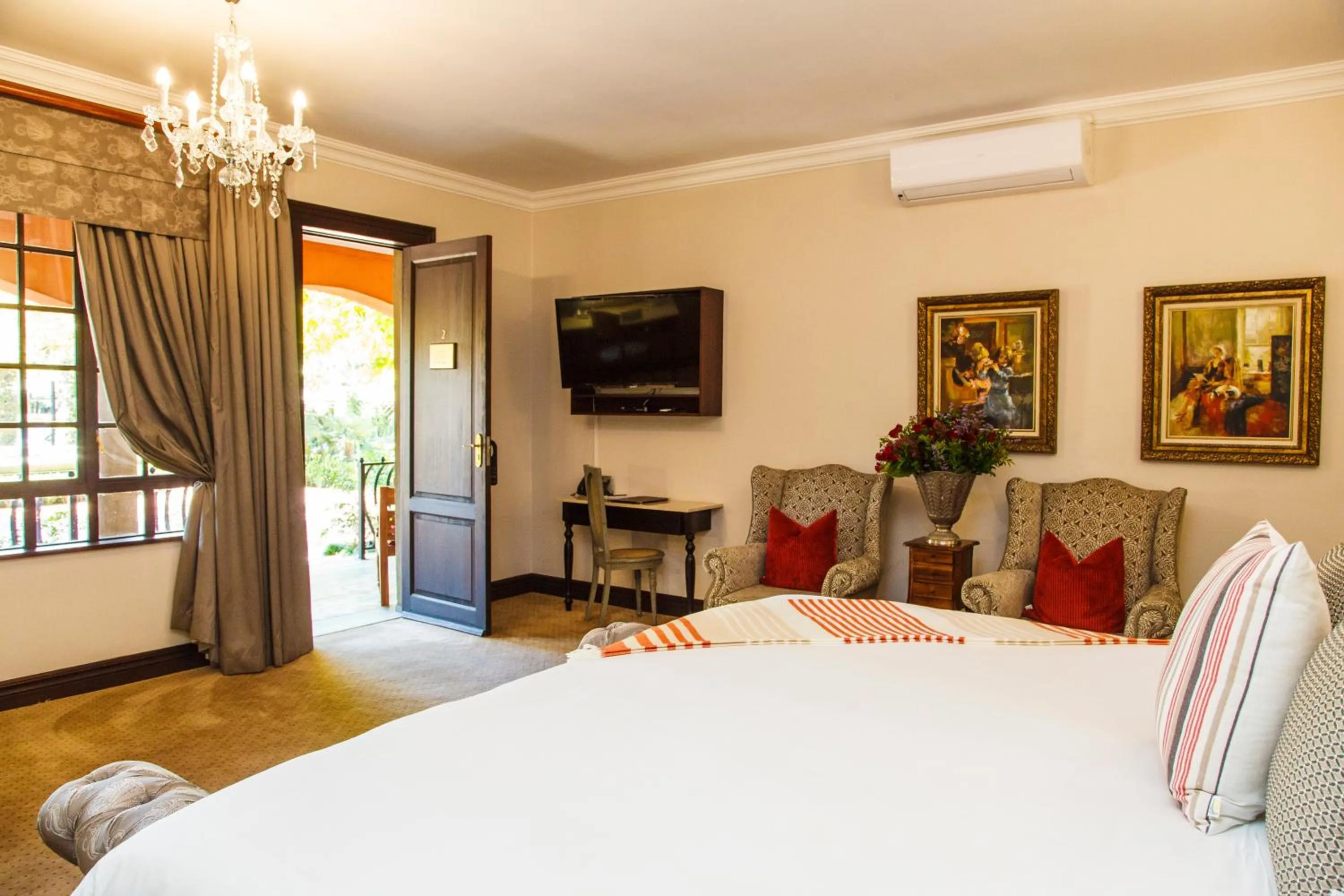 Seating area, Bed in Ivory Manor Boutique Hotel