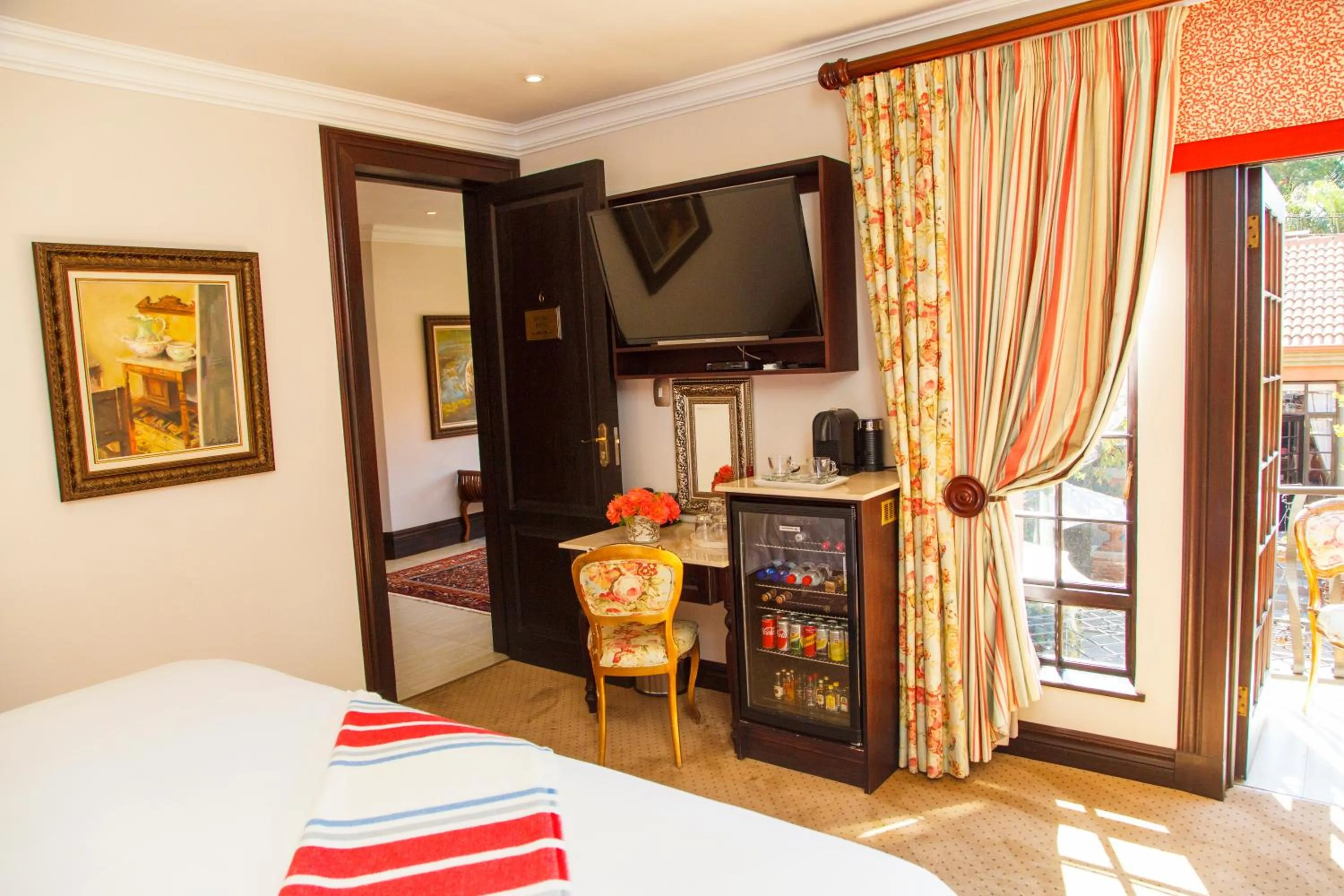 Communal lounge/ TV room, Bed in Ivory Manor Boutique Hotel