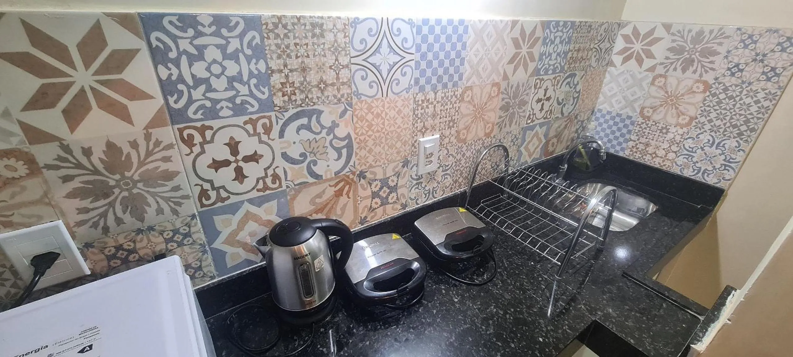 Communal kitchen in Recanto Del Mare Suítes