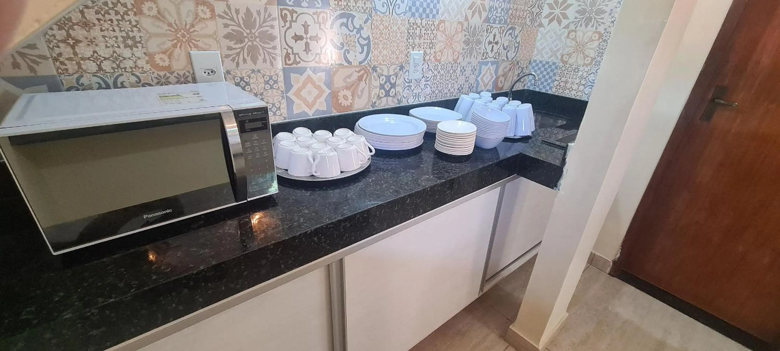 Communal kitchen in Recanto Del Mare Suítes