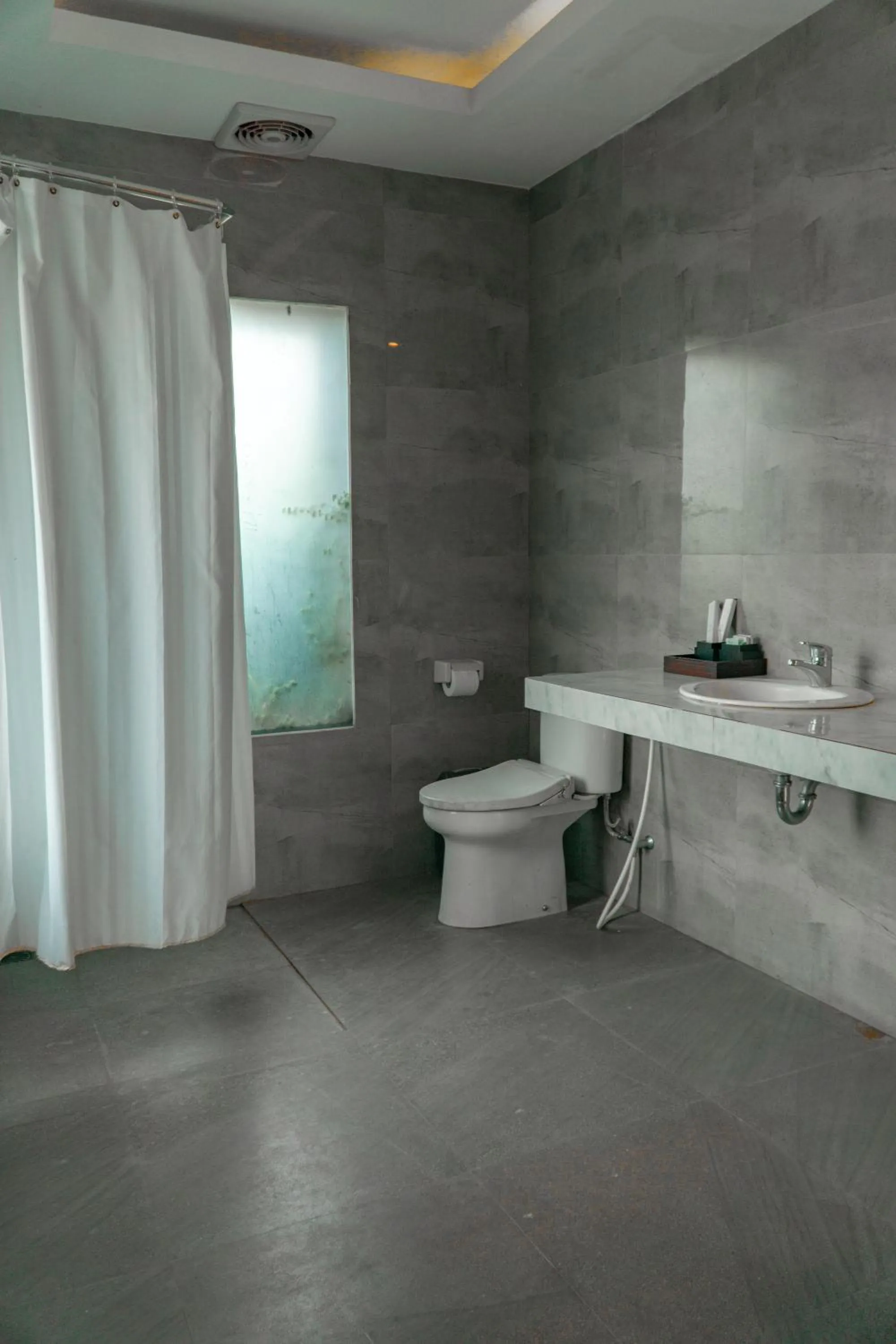 Toilet in Umadhatu Resort by Amerta