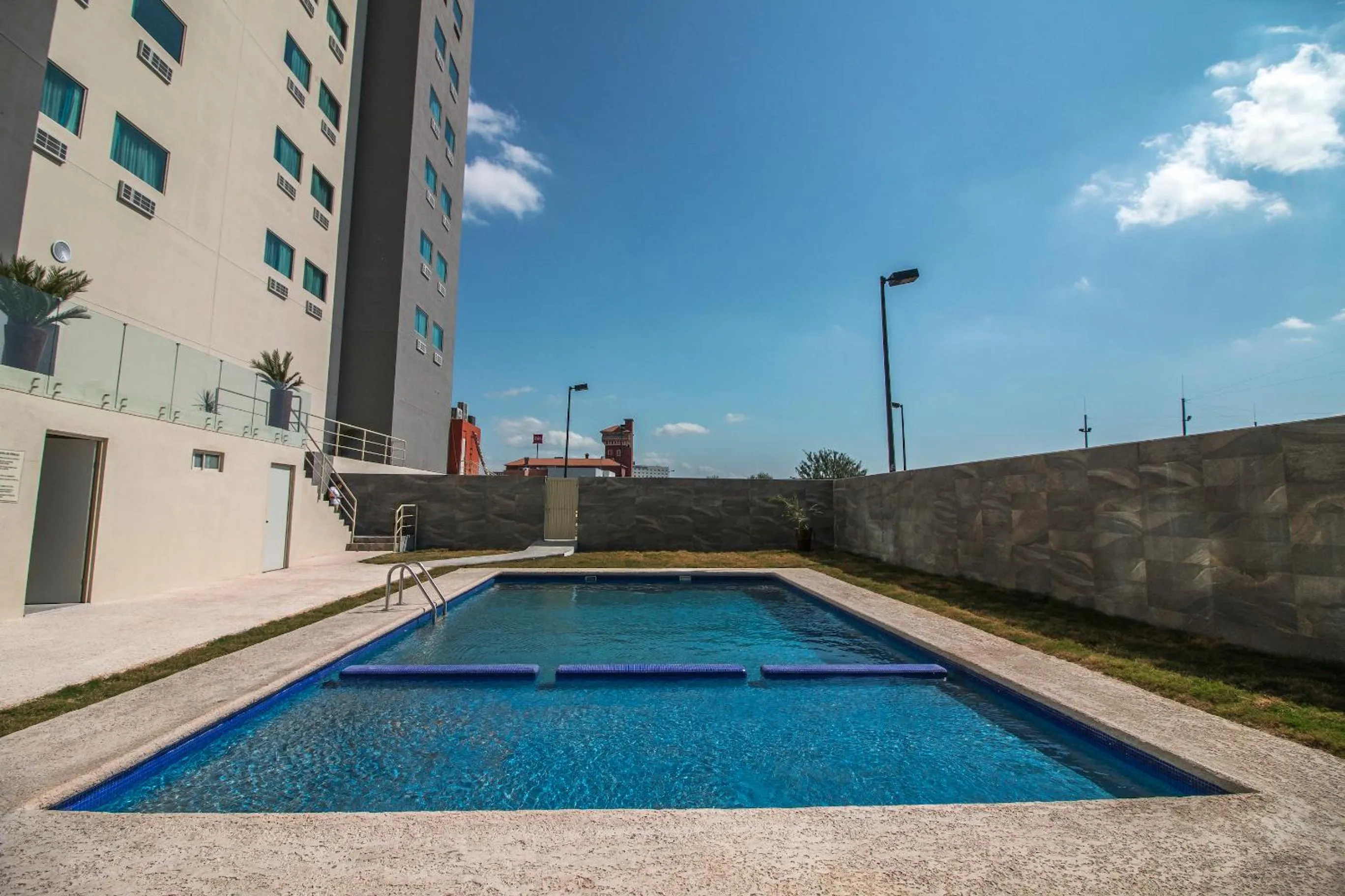 Swimming pool in CHN Hotel Monterrey Aeropuerto, Trademark by Wyndham