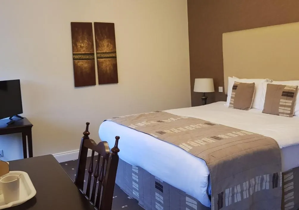 Bed in The Tontine Hotel