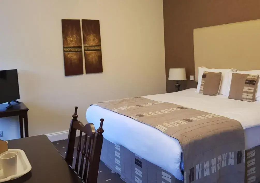 Bed in The Tontine Hotel Bed in The Tontine Hotel