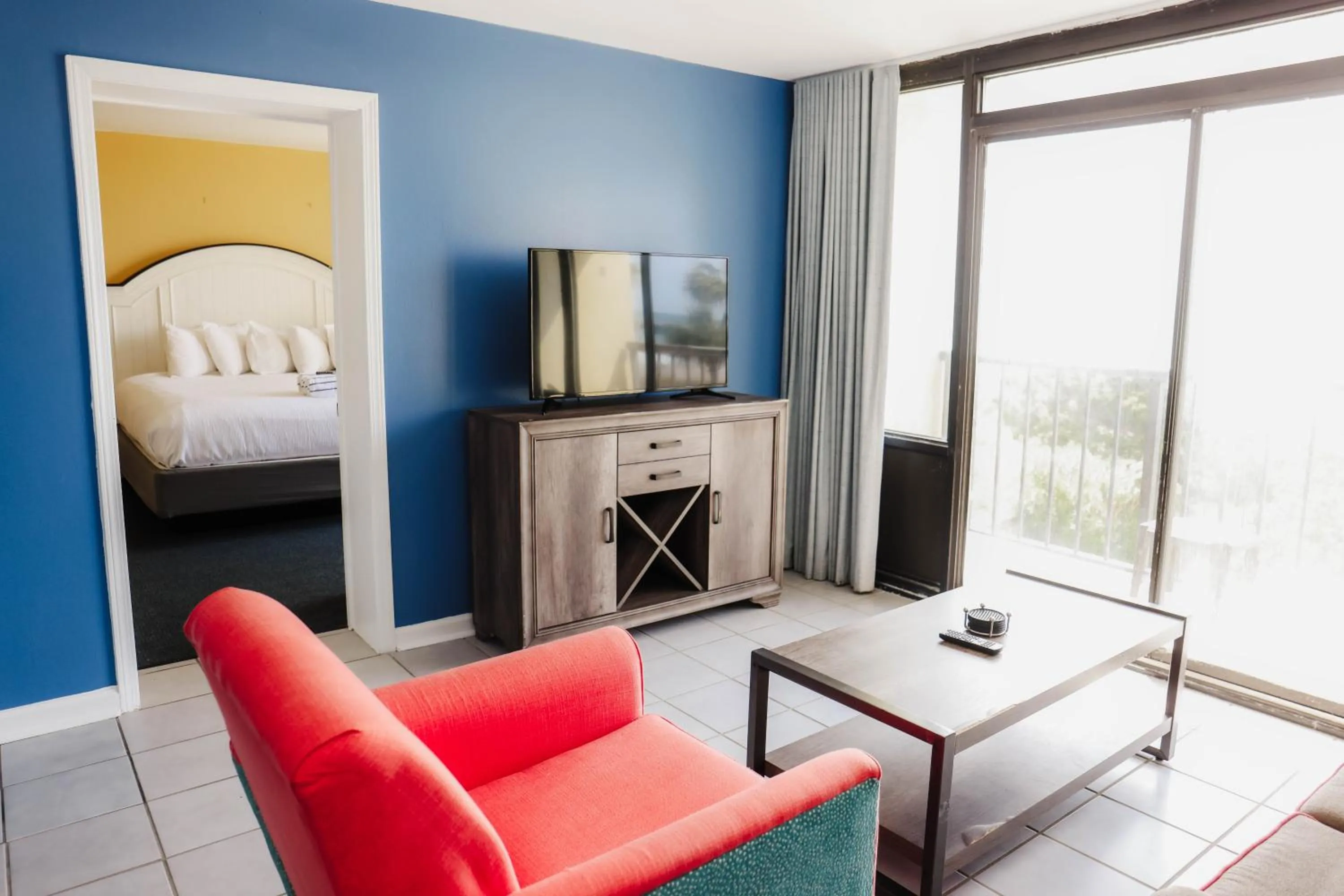 Living room, Bed in Ocean Club Resort Myrtle Beach a Ramada by Wyndham