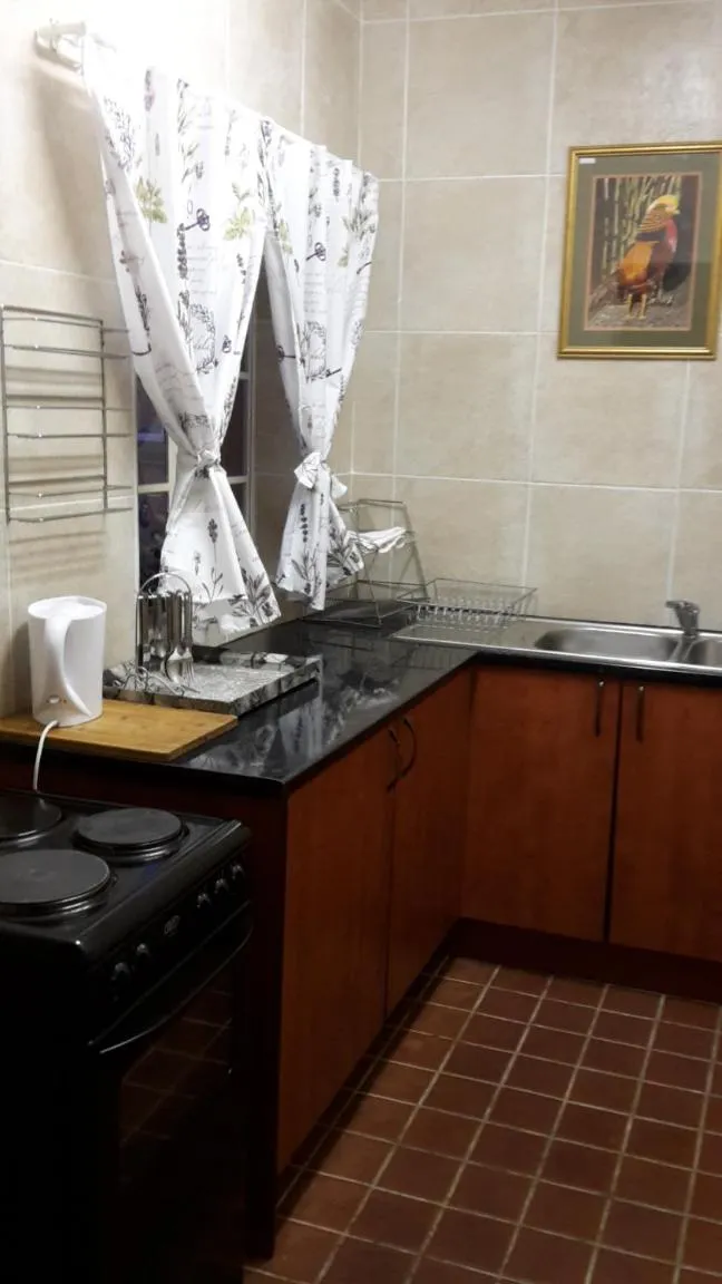 Kitchen or kitchenette in Amberlight Self Catering Accommodation