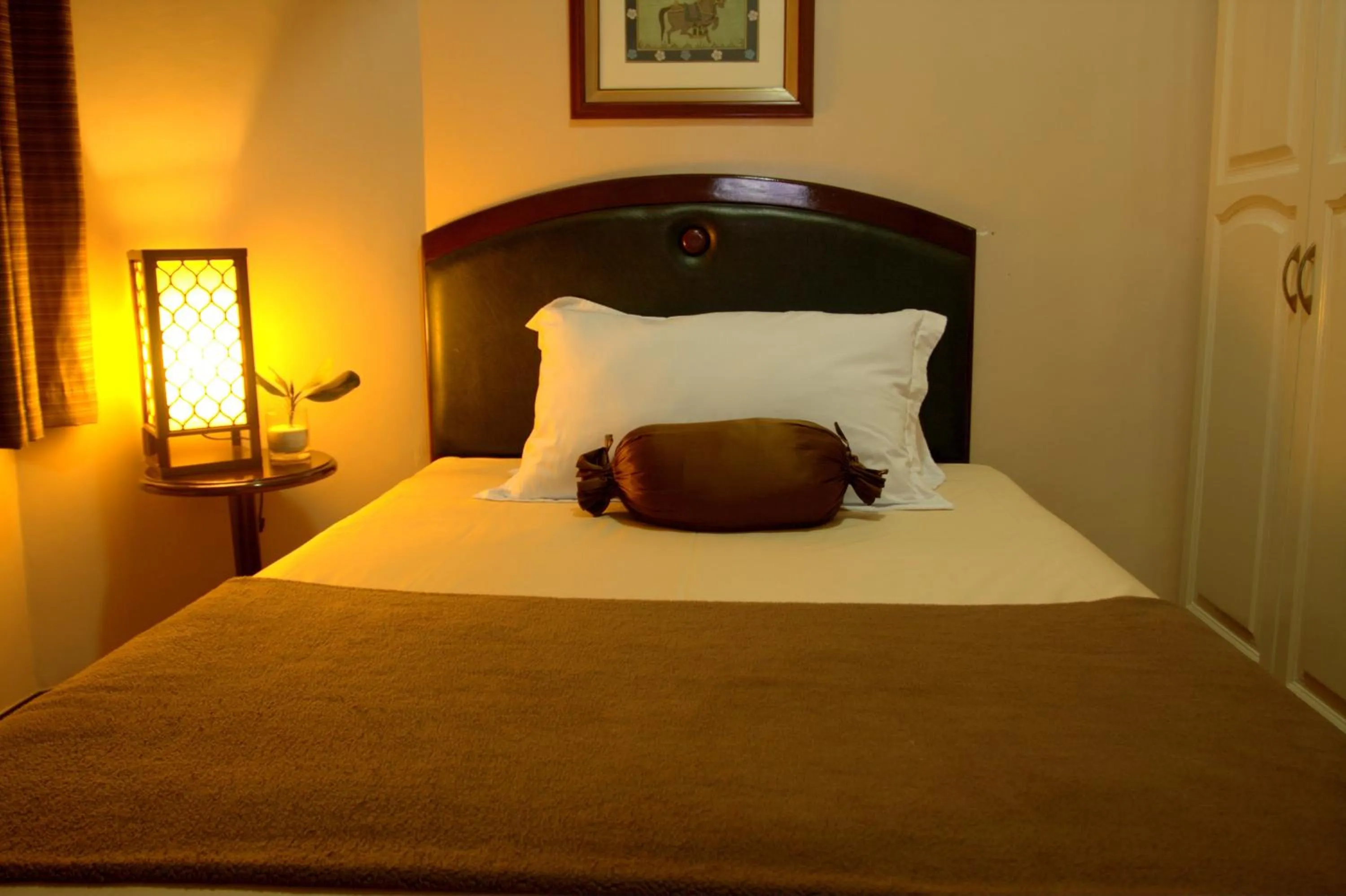 Bed in Prince Plaza II Condotel