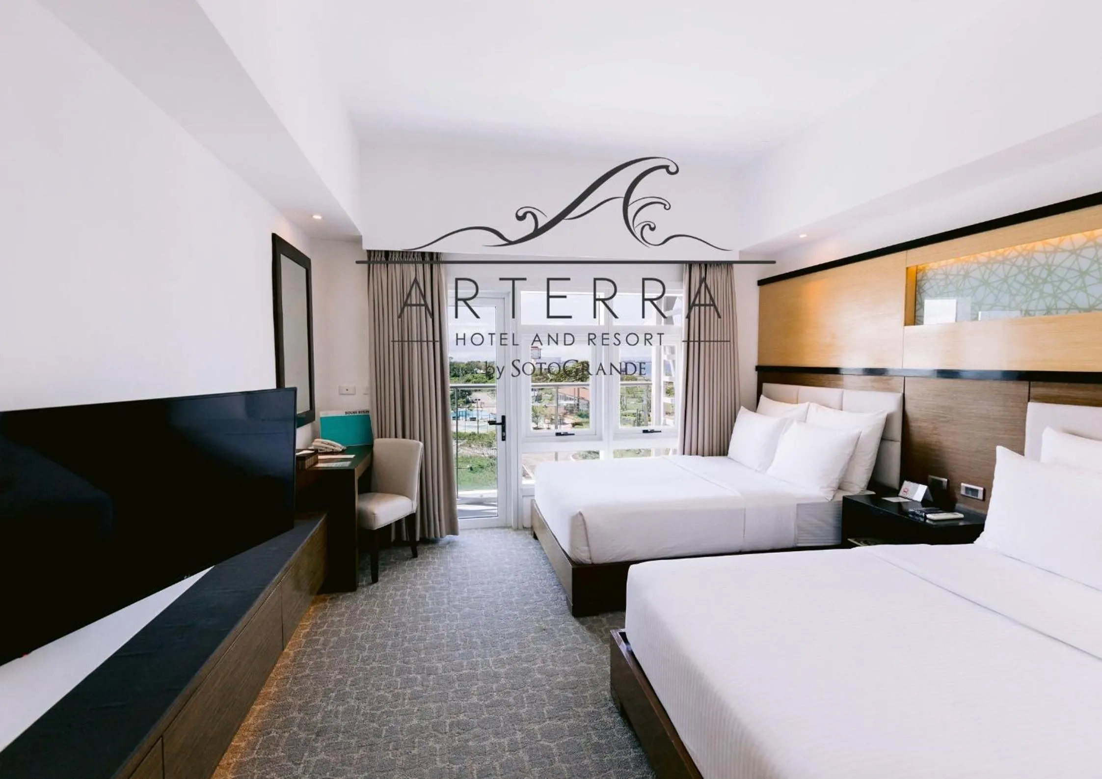 Bed in Arterra Hotel and Resort