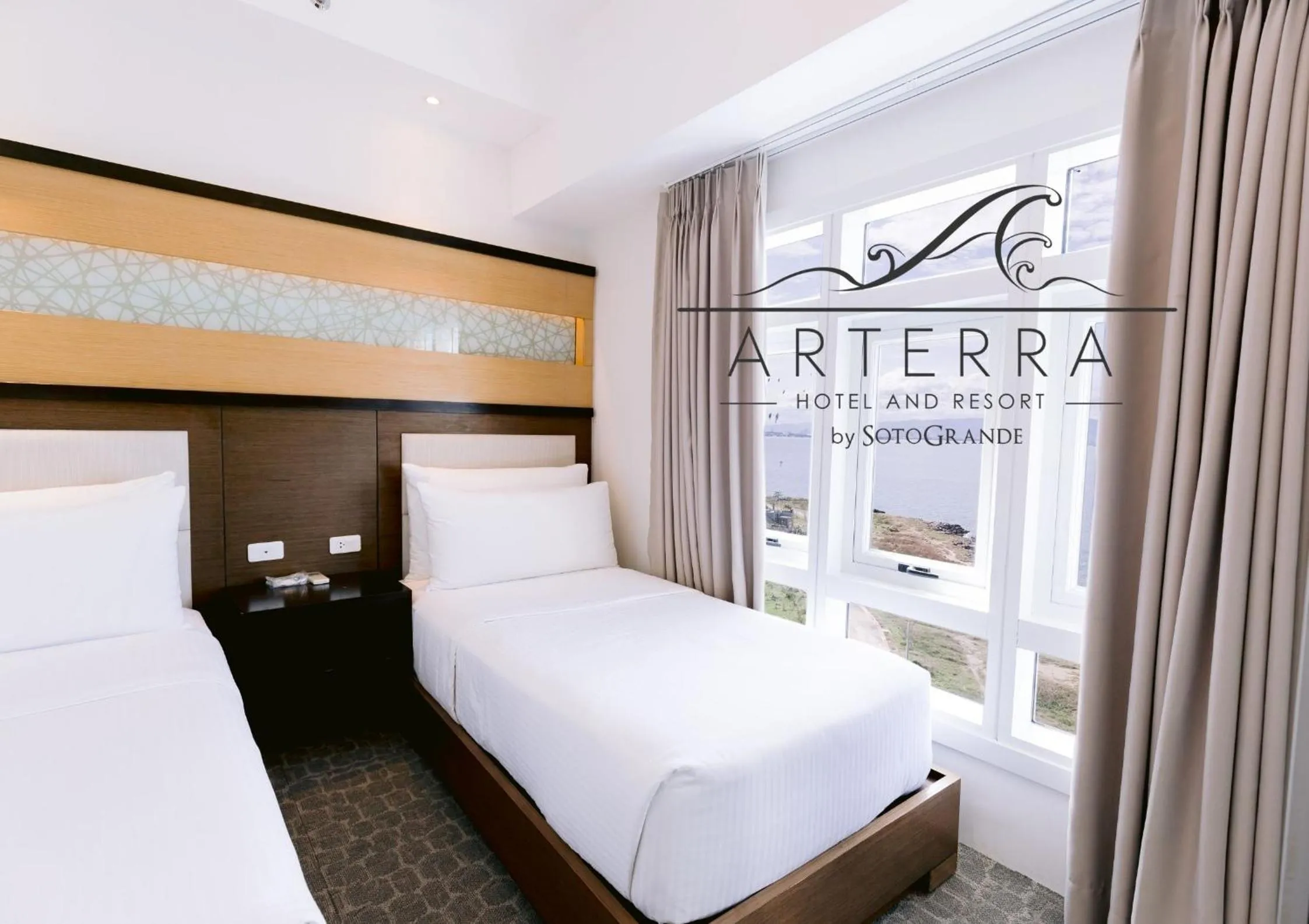 Bed in Arterra Hotel and Resort