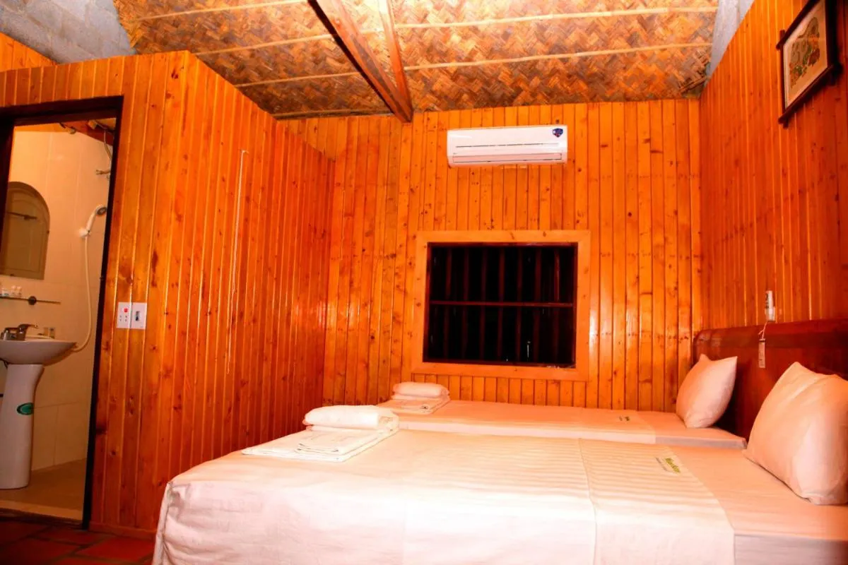 Bed in Whisper Nature Bungalow & Resort
