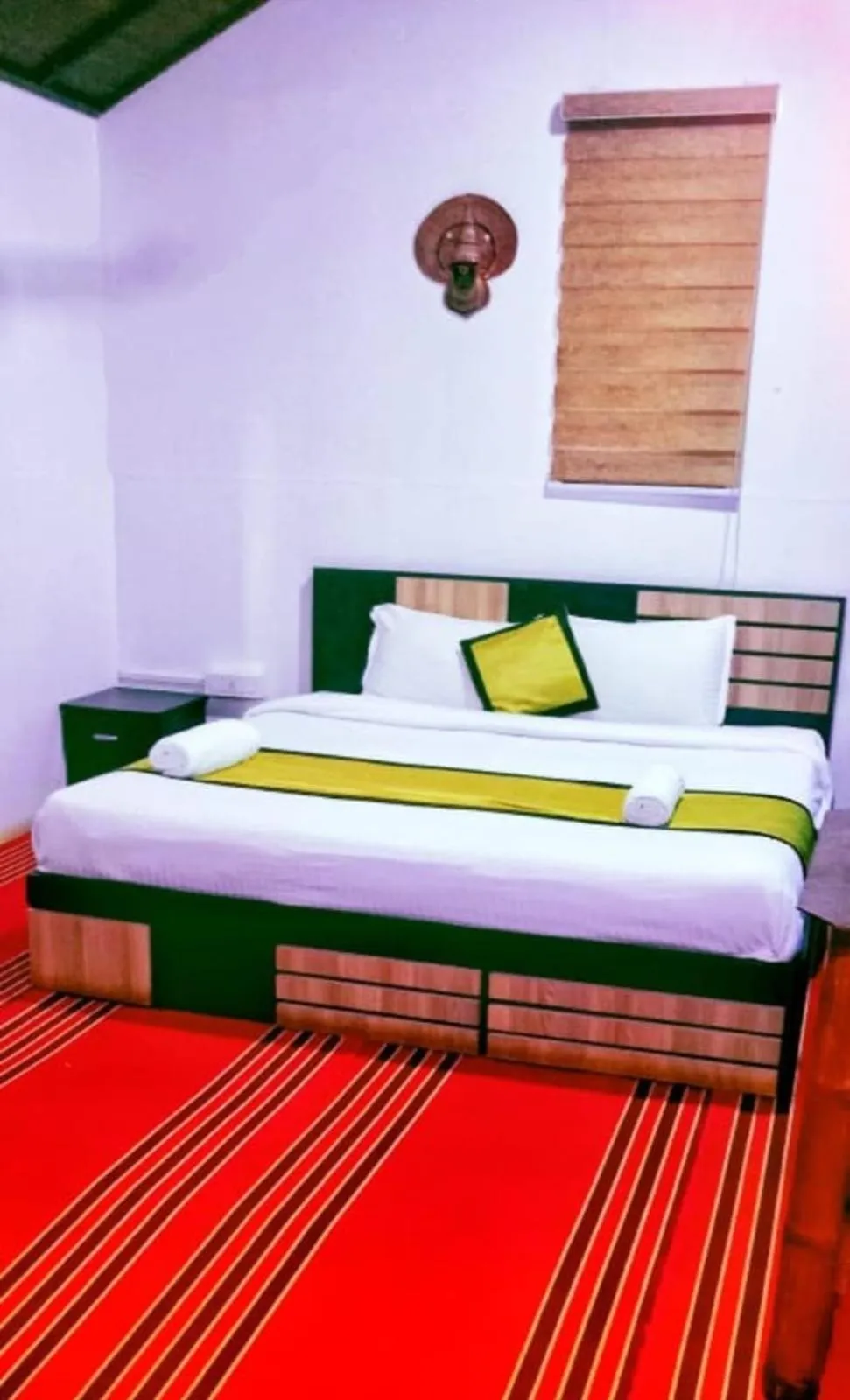 Bed in KOOMANKOLLY RESORT