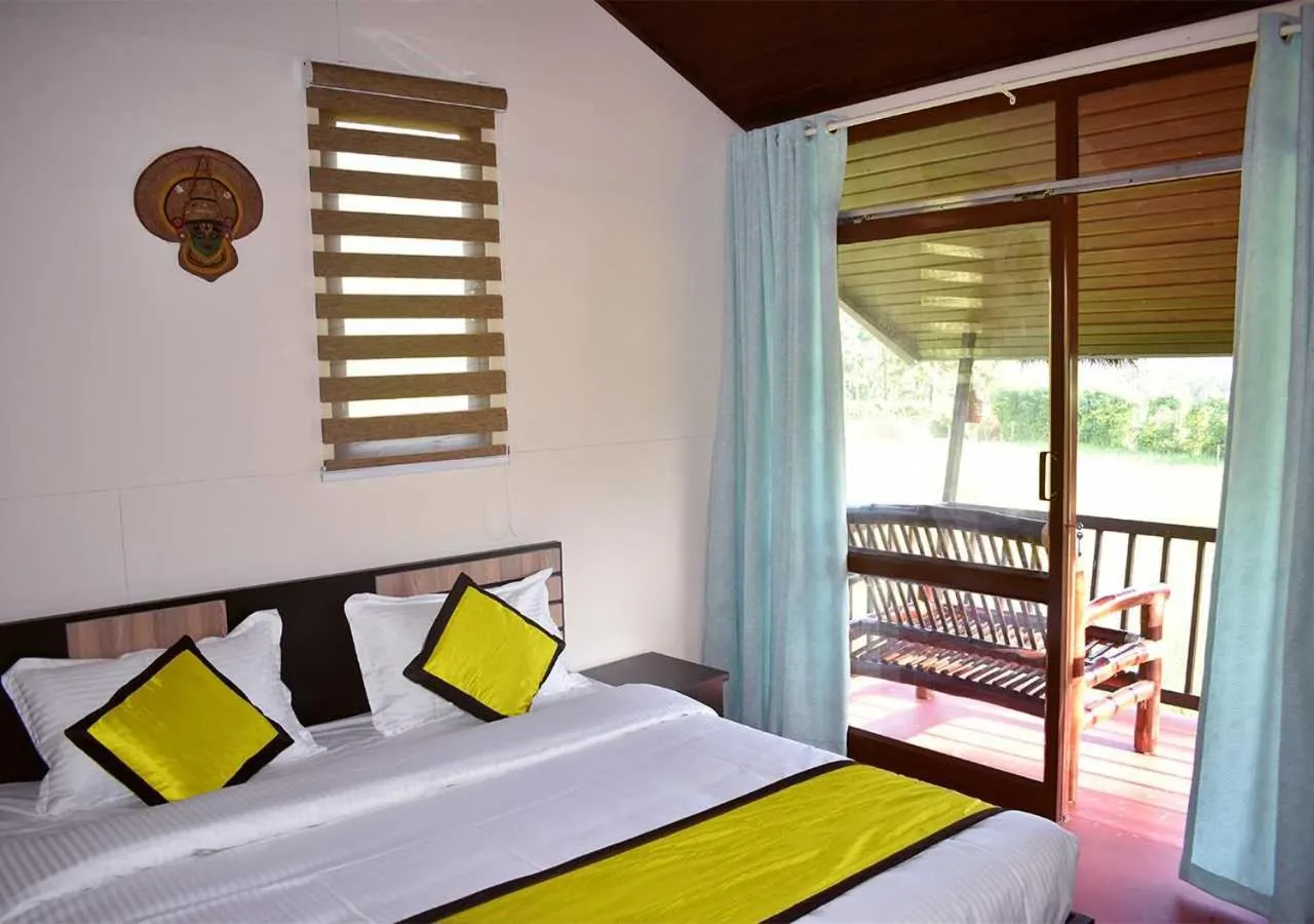 Bed in KOOMANKOLLY RESORT