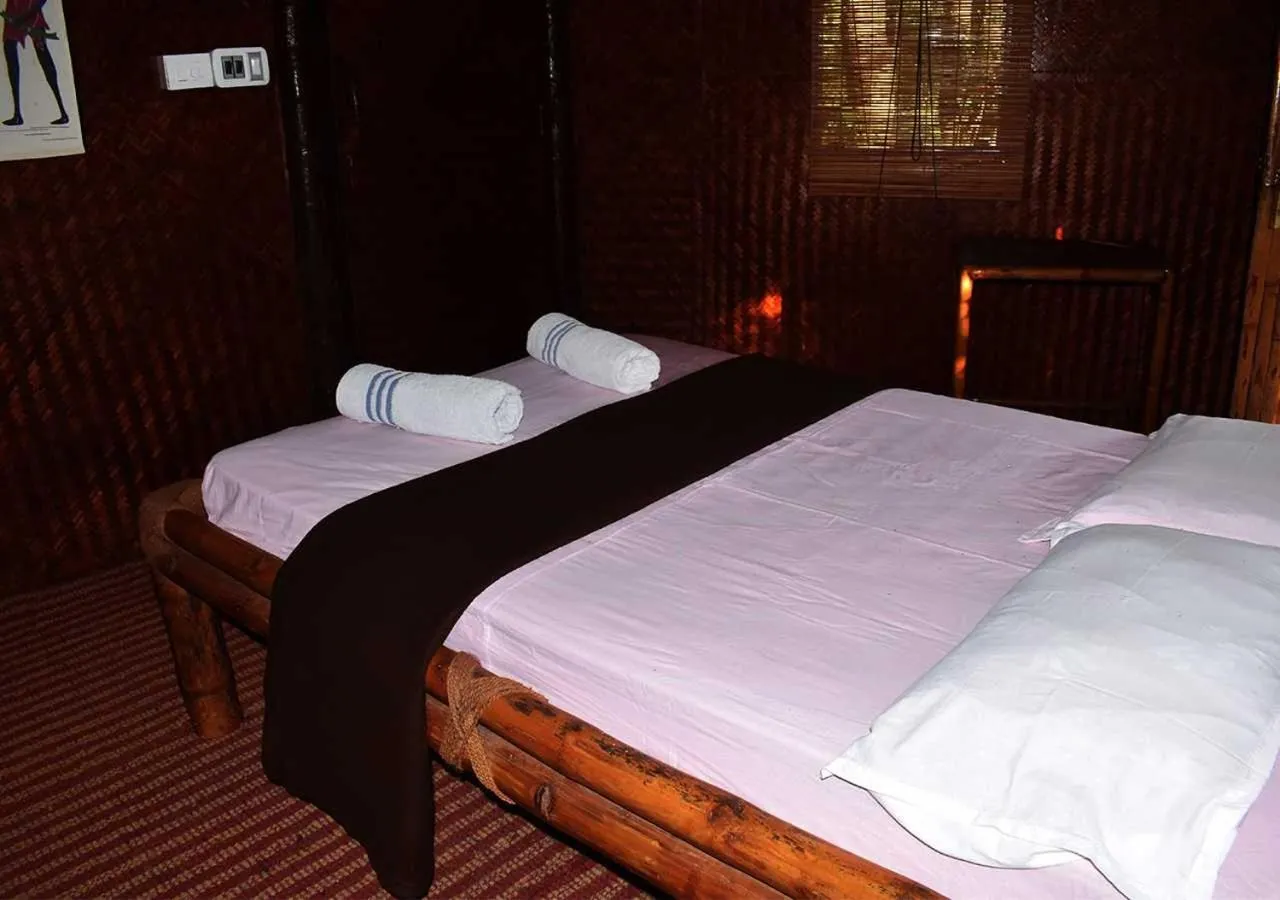 Bed in KOOMANKOLLY RESORT