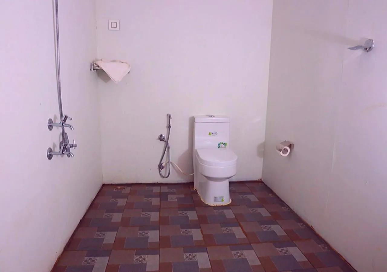 Bathroom in KOOMANKOLLY RESORT