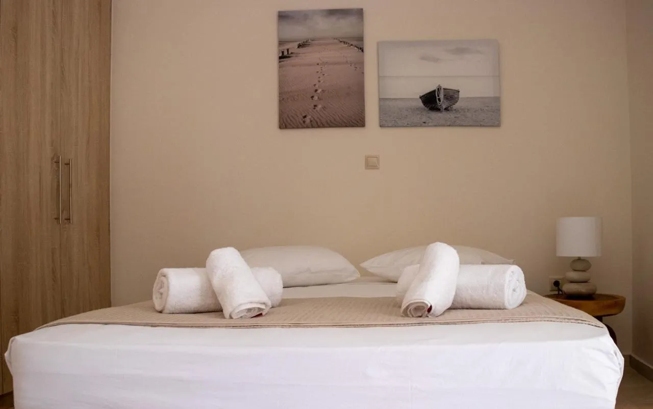 Bed in Grand Bleu Apartments & Villas