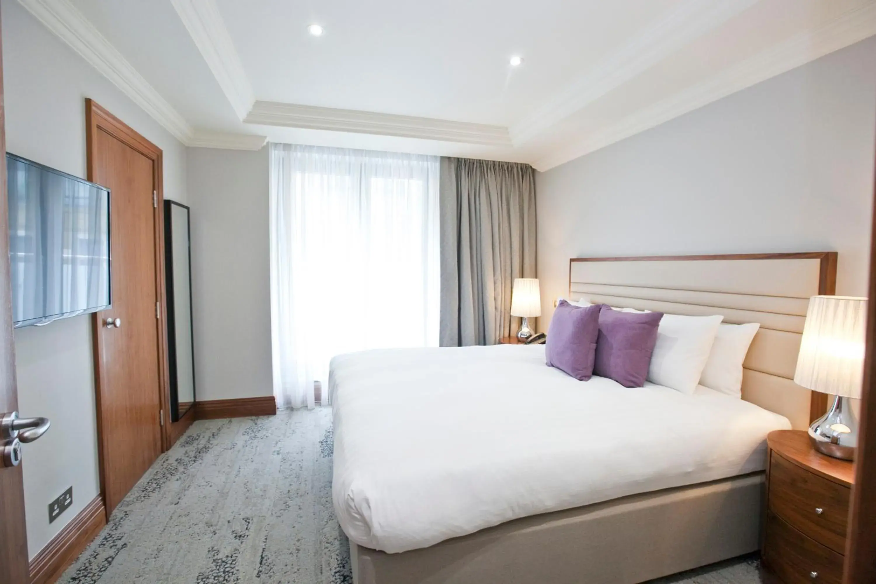 Bed in Sanctum International Serviced Apartments