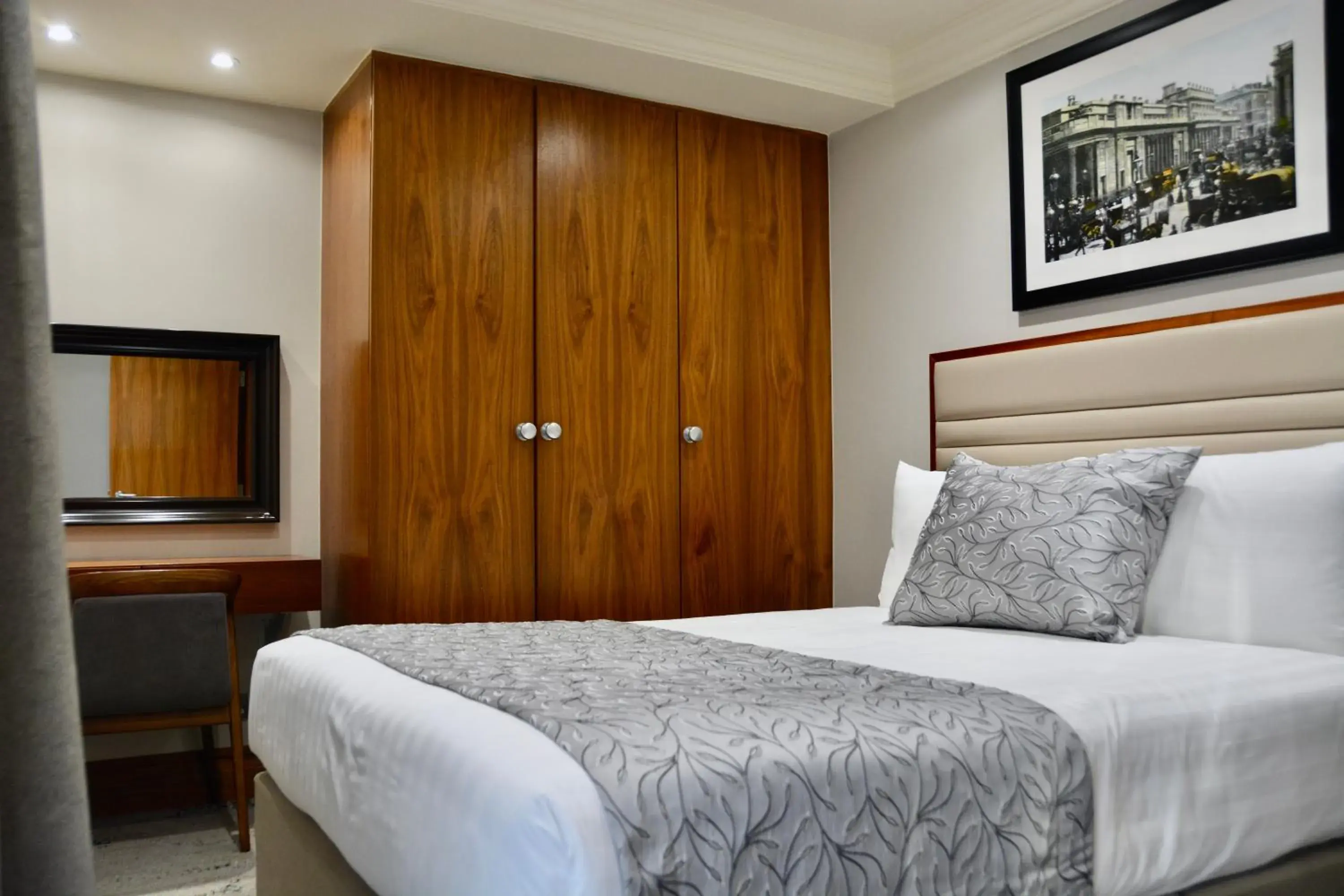 Bed in Sanctum International Serviced Apartments