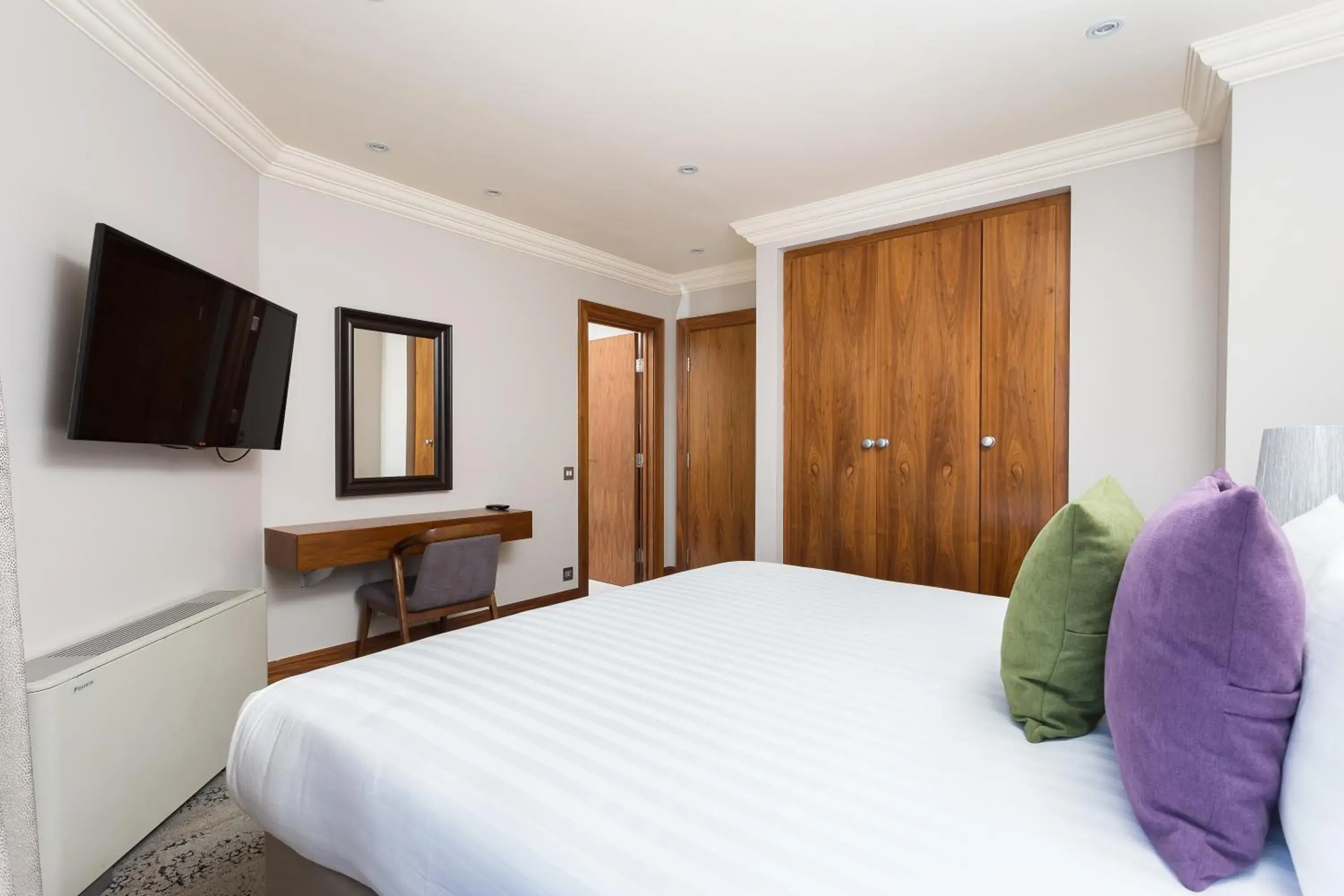 Bed in Sanctum International Serviced Apartments