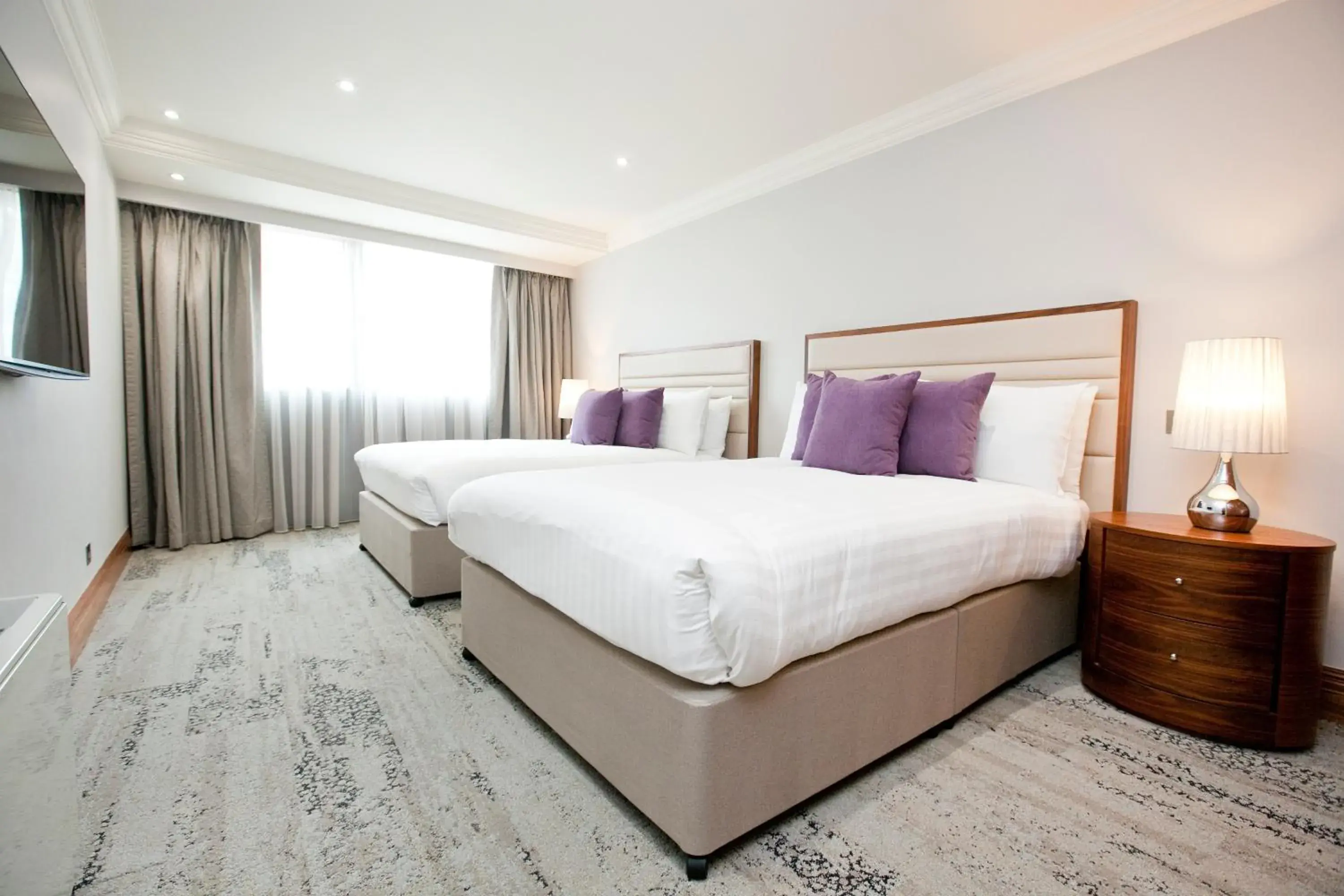 Bed in Sanctum International Serviced Apartments