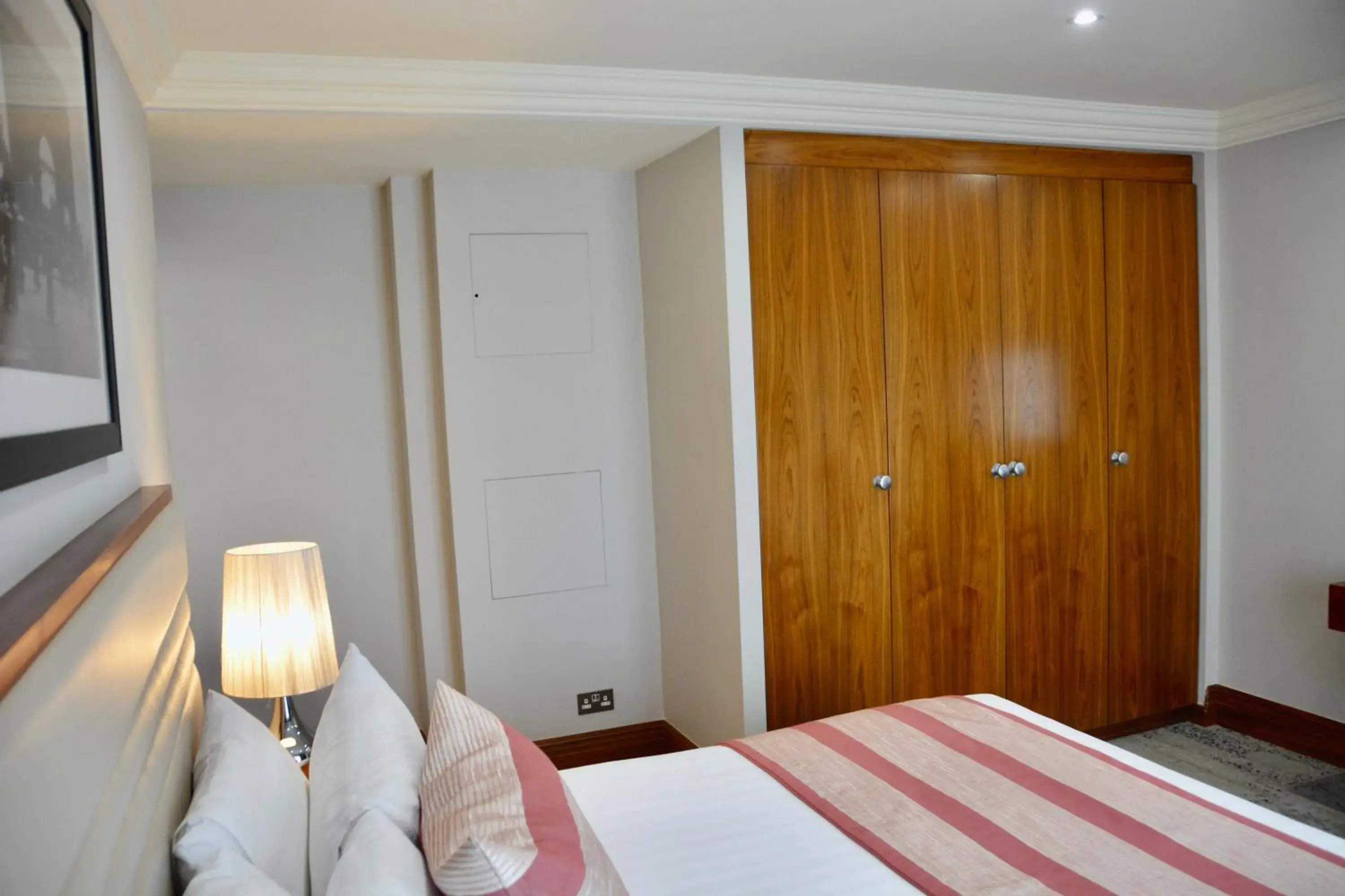 Bed in Sanctum International Serviced Apartments