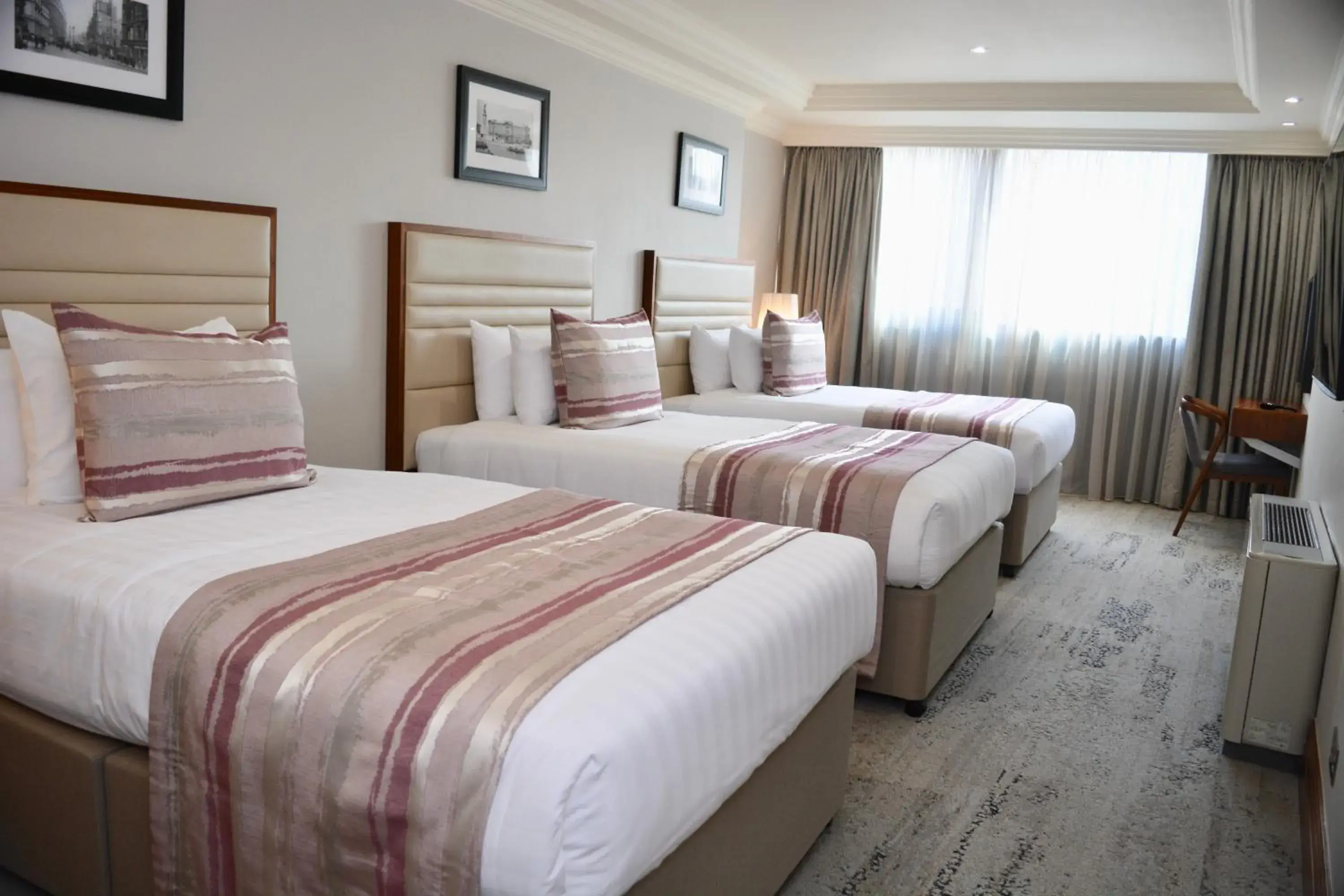 Bed in Sanctum International Serviced Apartments