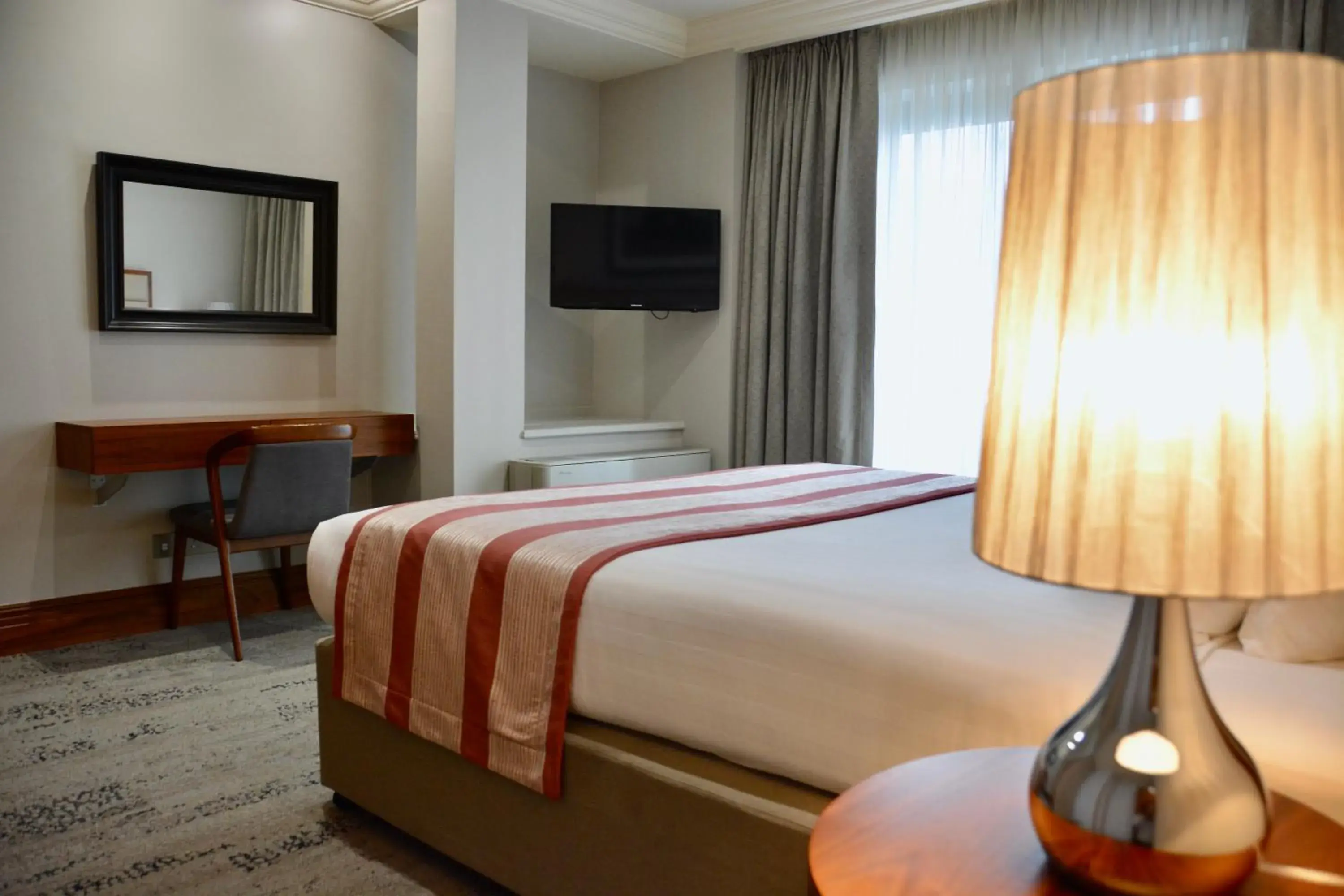 Bed in Sanctum International Serviced Apartments