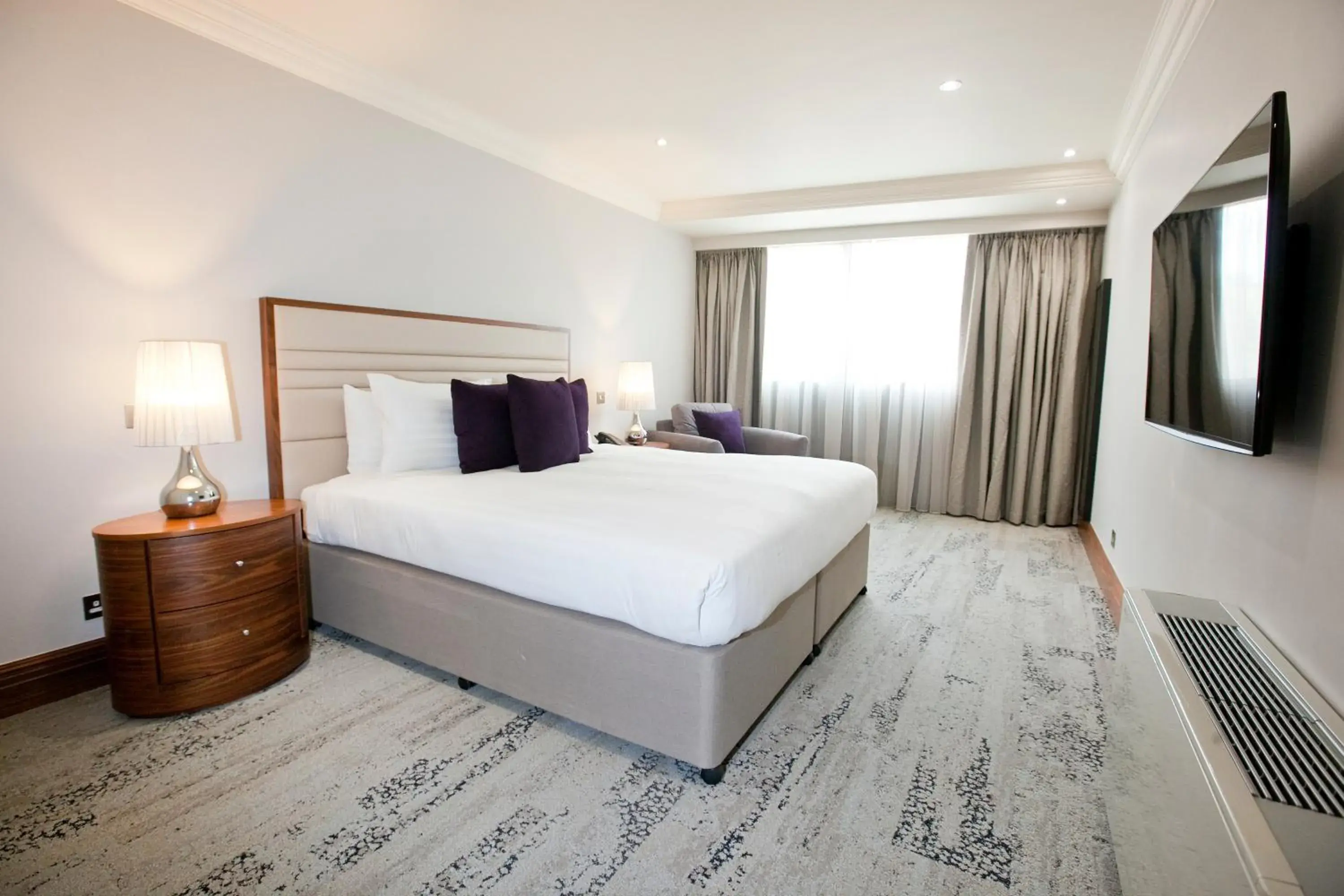 Bed in Sanctum International Serviced Apartments