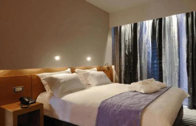 Bed in Galaxy City Center Hotel