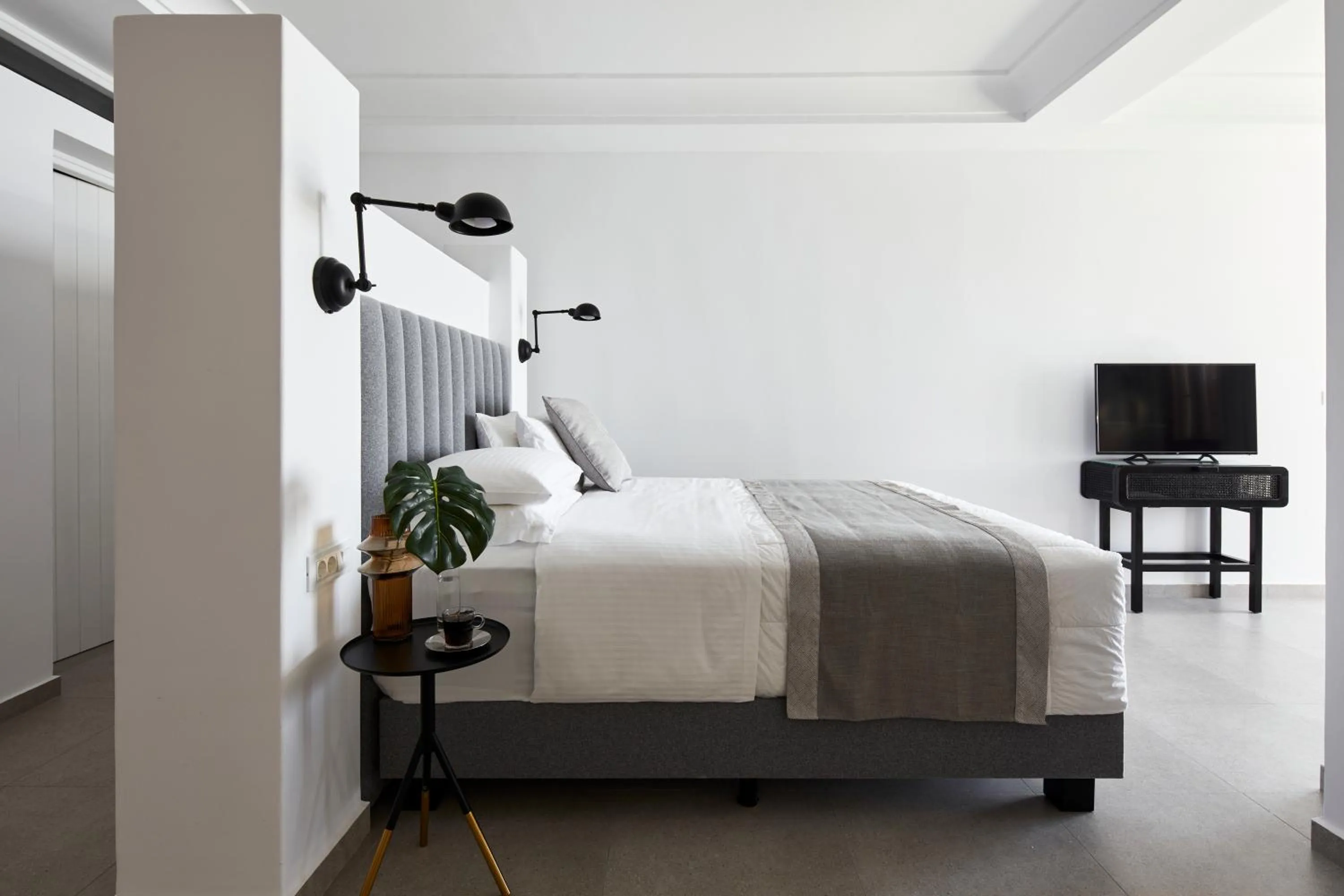 Bed in Petit Palace Suites