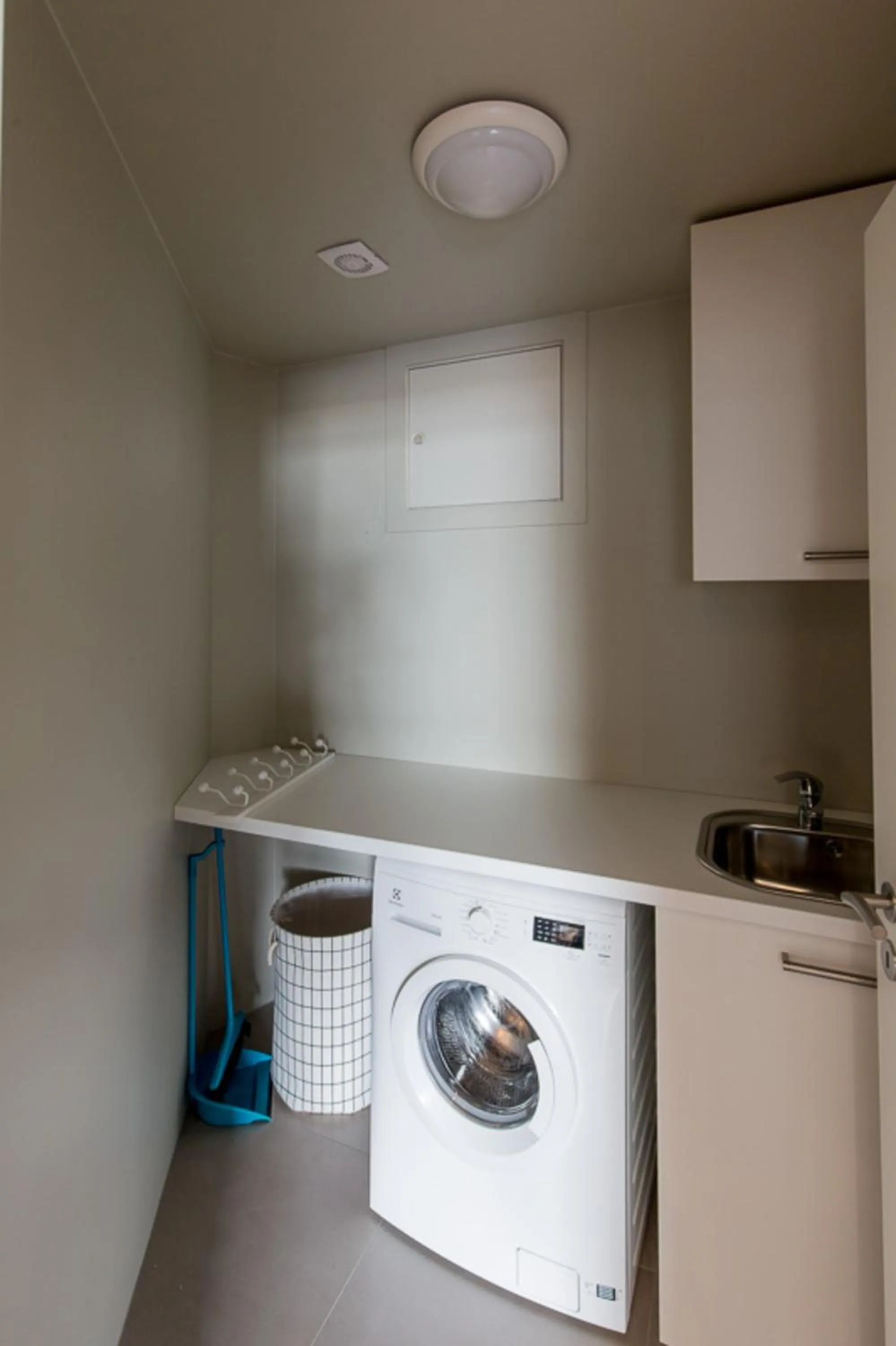washing machine in Acco Luxury Apartments