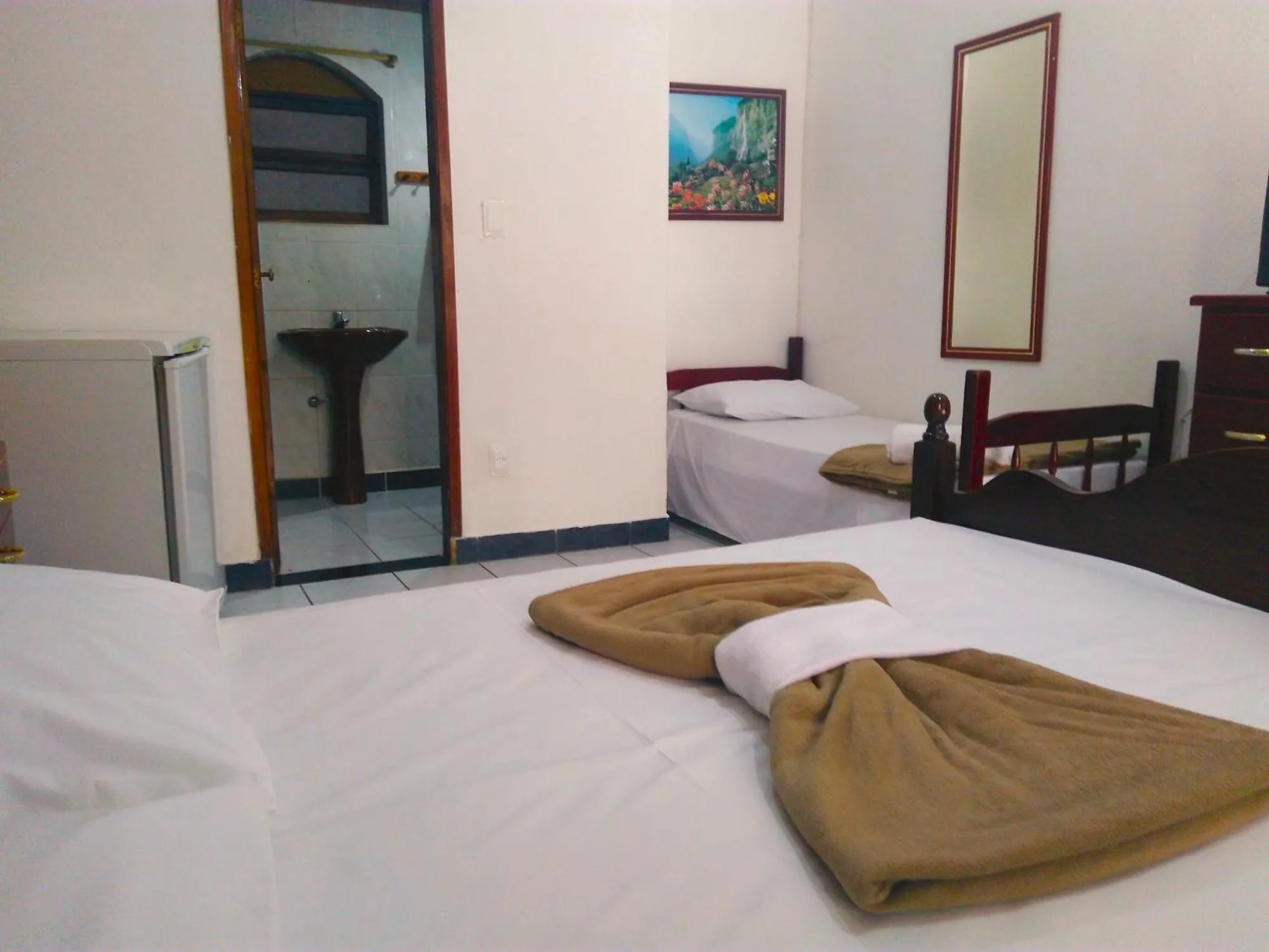 Photo of the whole room, Bed in Pousada Chale Suísso