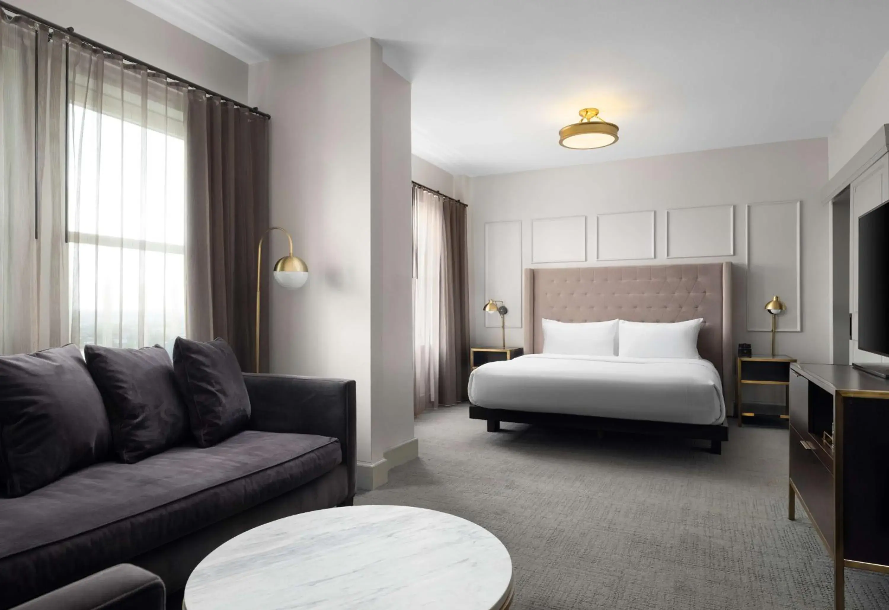 Living room, Bed in Hotel Phillips Kansas City, Curio Collection By Hilton Living room, Bed in Hotel Phillips Kansas City, Curio Collection By Hilton